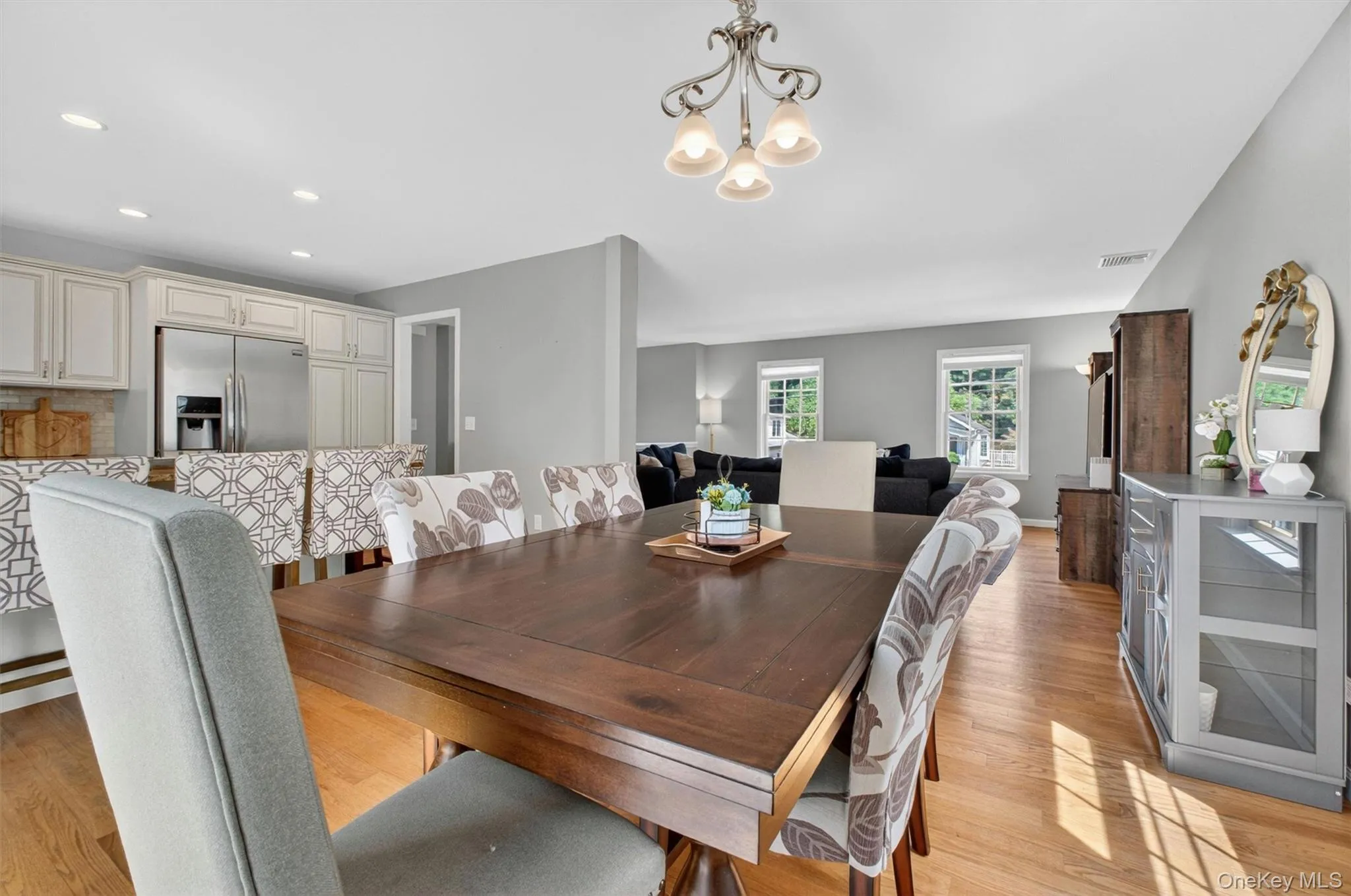 Dining room to living room and kitchen. Dining room to living room and kitchen.