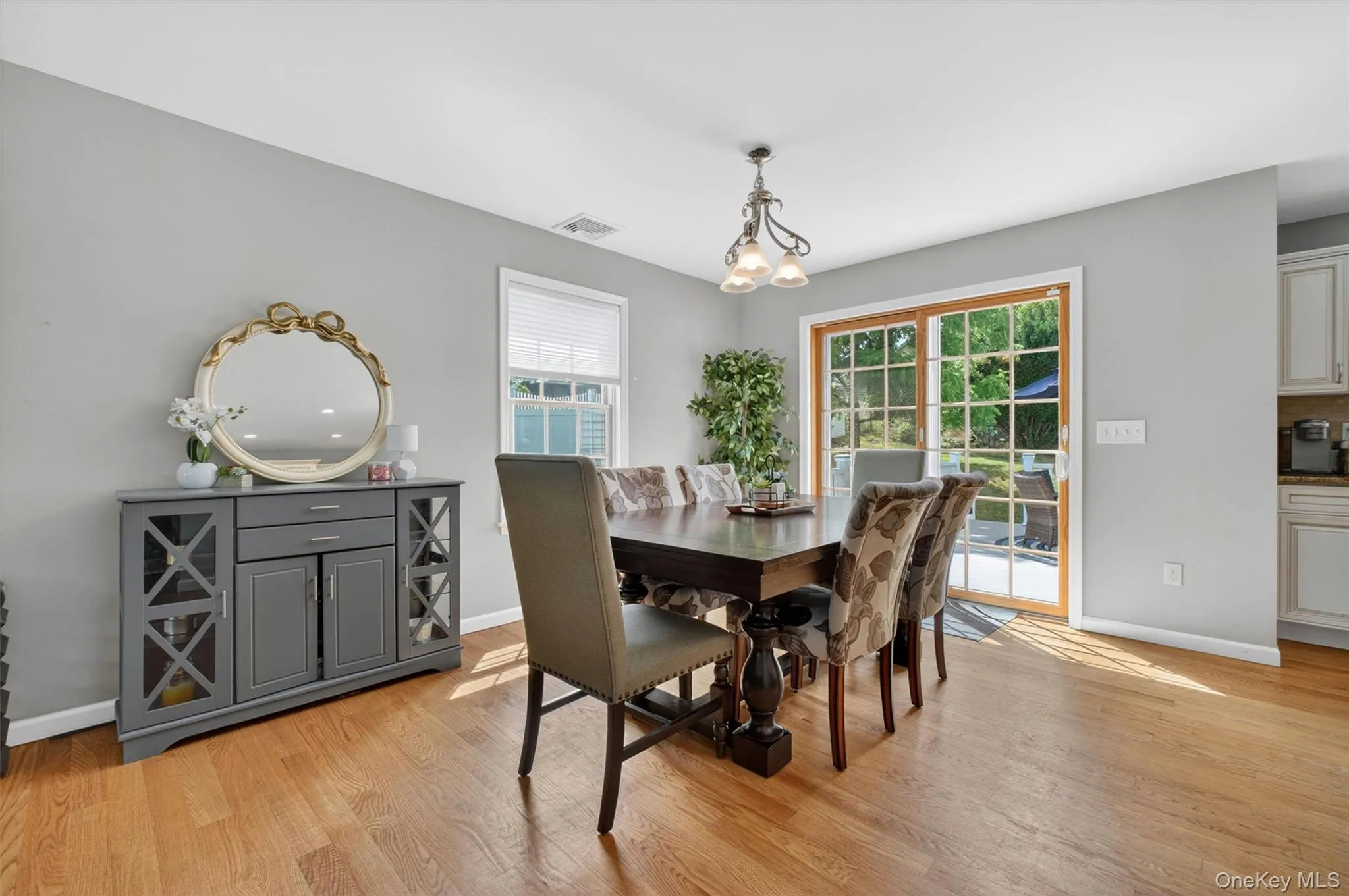 The sliding glass door in dining room leads to the oversized composite deck. The sliding glass door in dining room leads to the oversized composite deck.