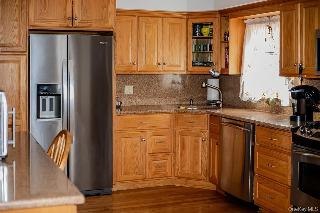 Large kitchen with breakfast bar and plenty of counter space and cabinets Large kitchen with breakfast bar and plenty of counter space and cabinets