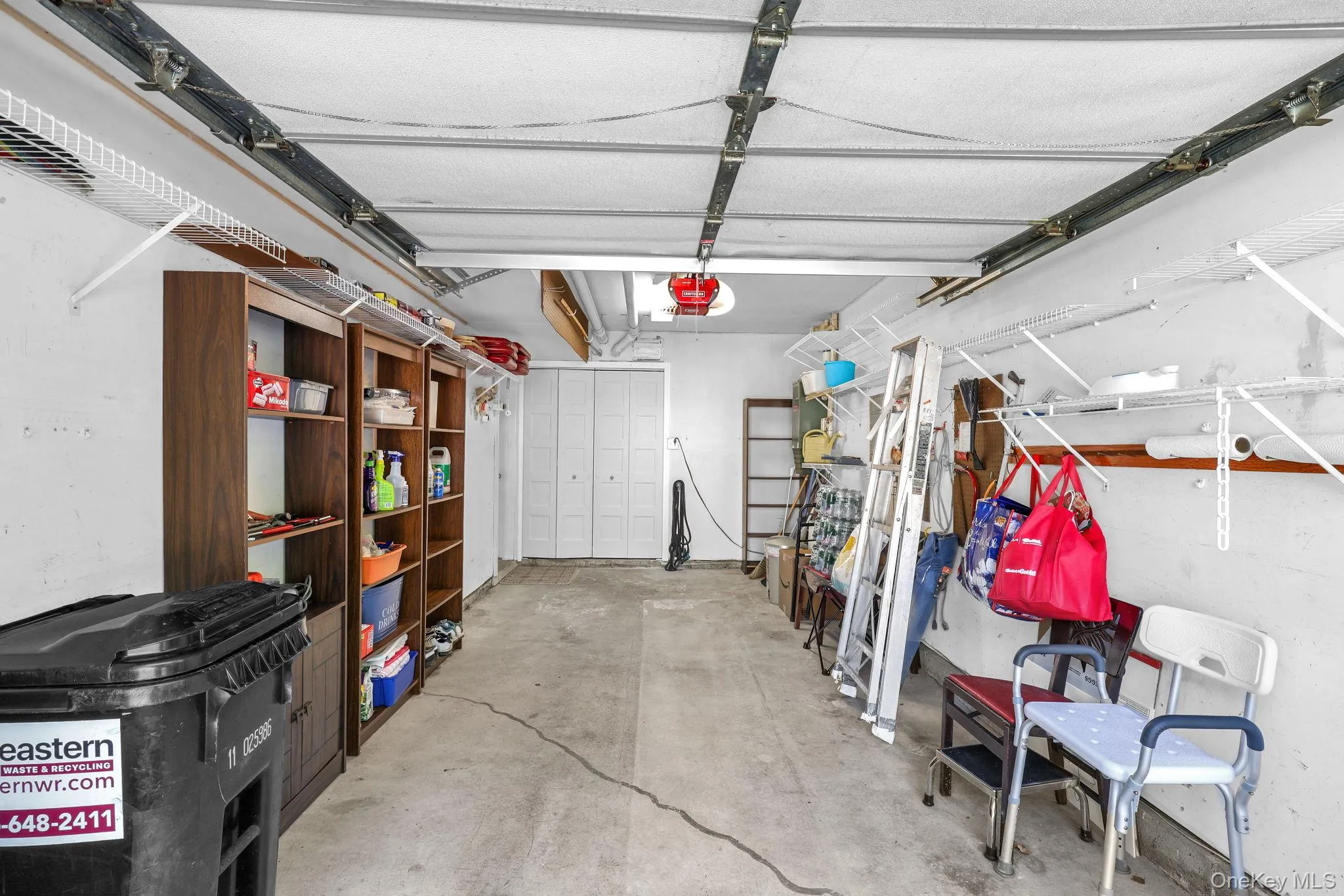 One car garage with utility closet and water hose access. One car garage with utility closet and water hose access.