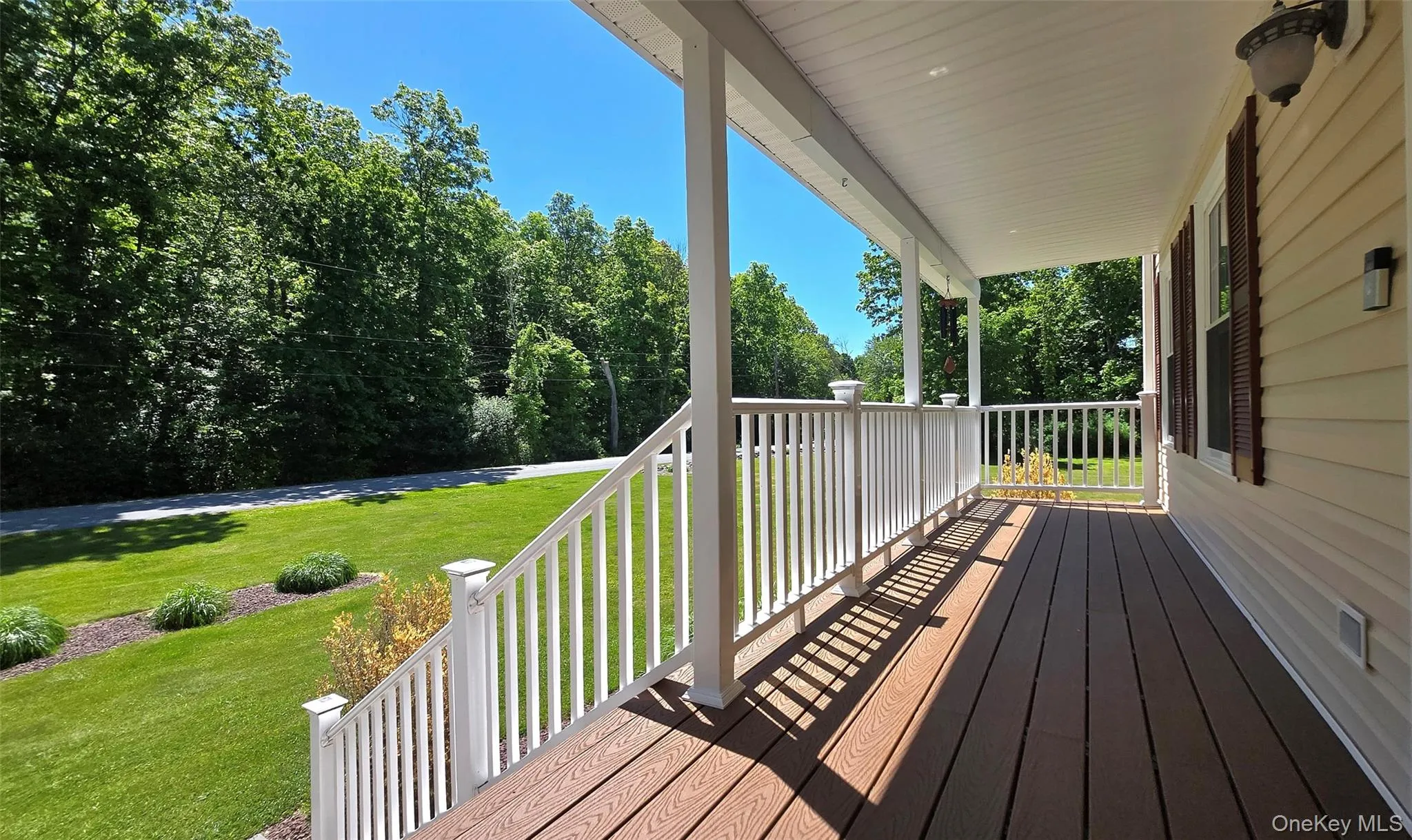 Nice Front Porch overlooking beautiful yard. Nice Front Porch overlooking beautiful yard.