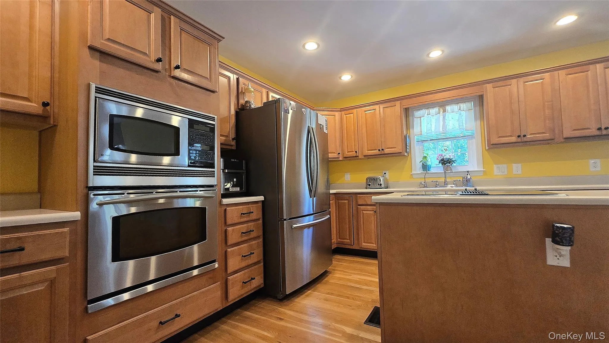 Maplewood cabinets host all new stainless steel appliances and hardwood floors Maplewood cabinets host all new stainless steel appliances and hardwood floors