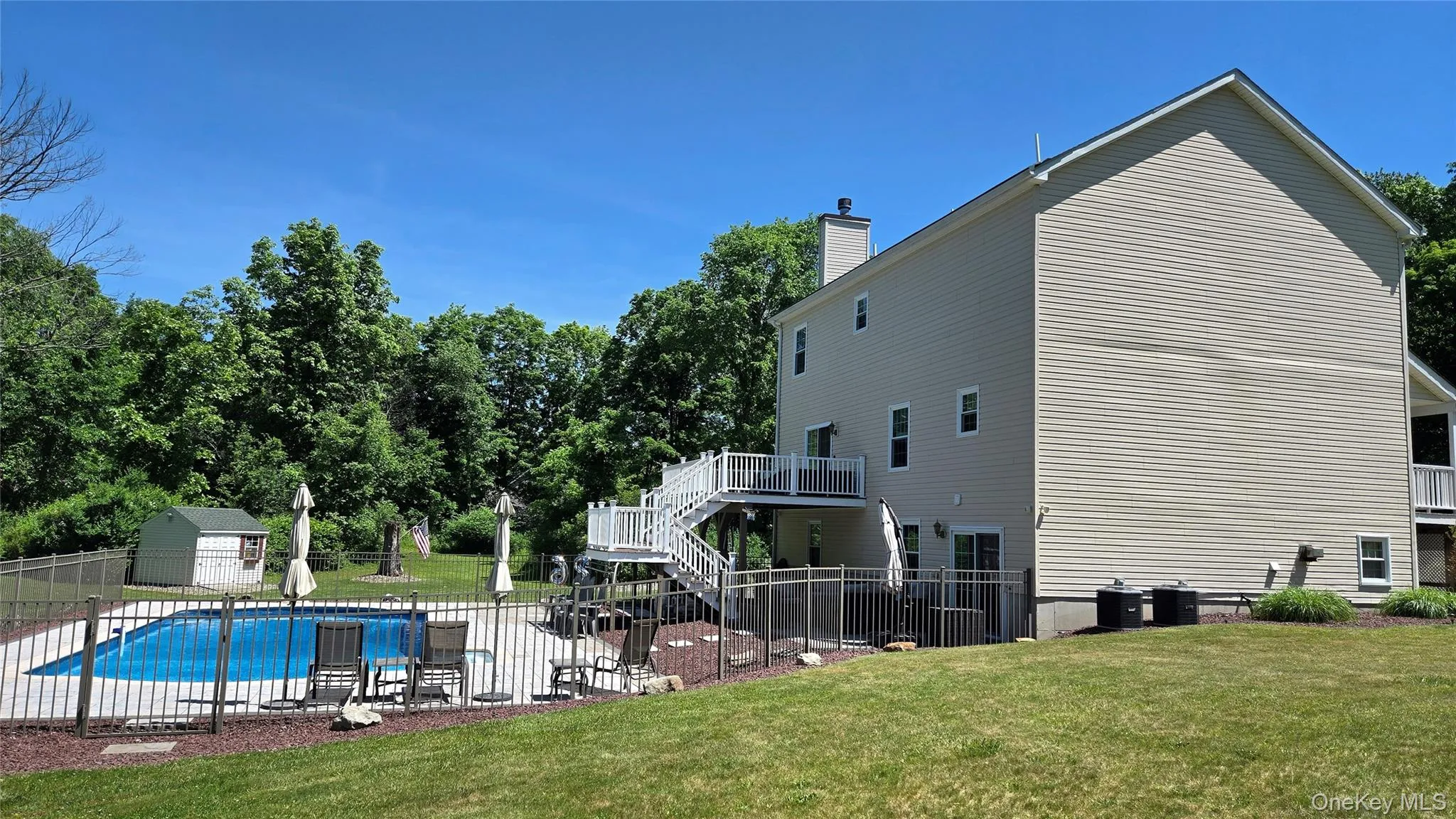 Another look to the fabulous backyard with pool and sitting areas. Another look to the fabulous backyard with pool and sitting areas.