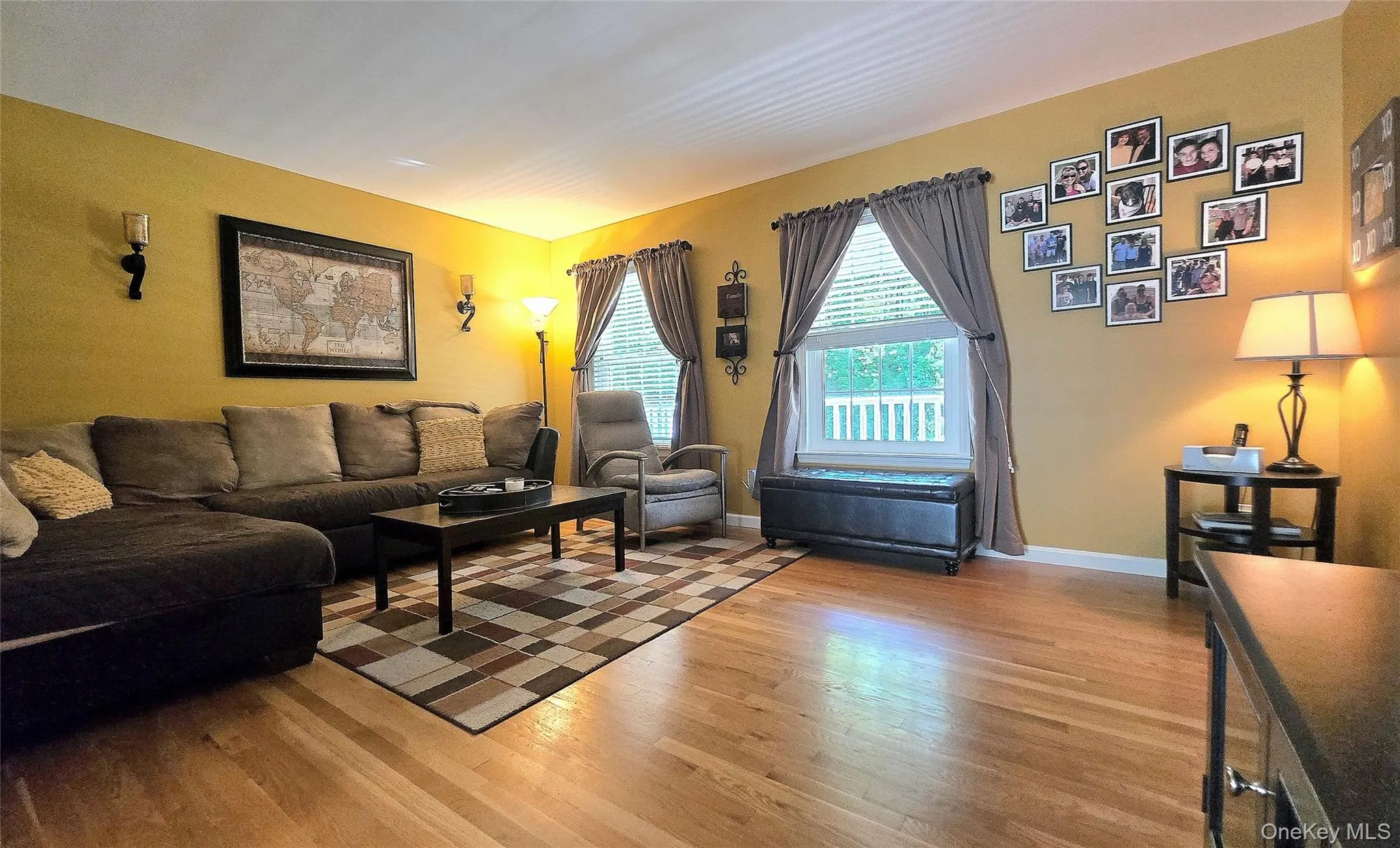 Living room with hardwood floors and large windows. Nice and bright! Living room with hardwood floors and large windows. Nice and bright!