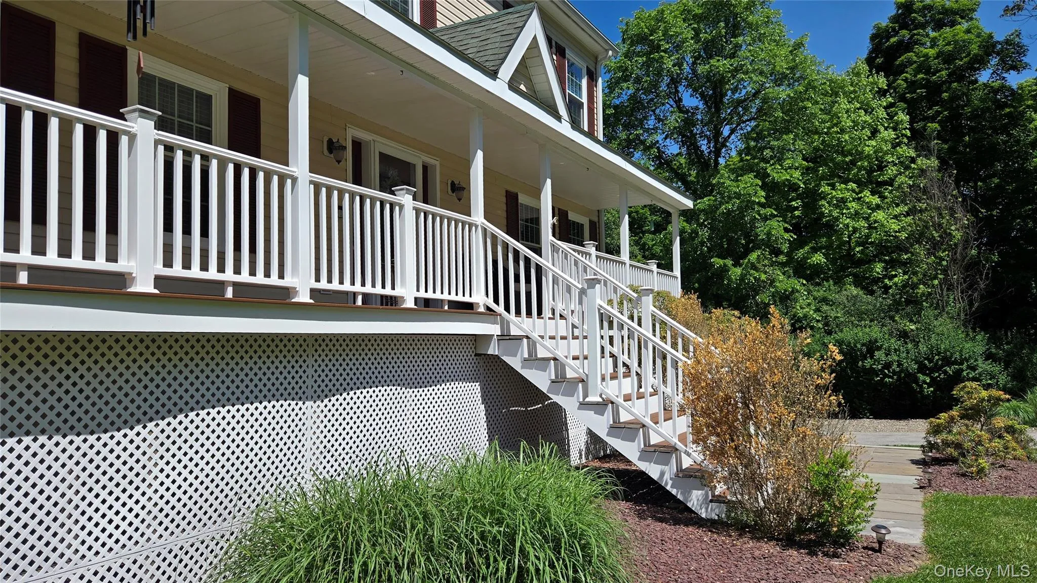 Close up look to rocking chair front porch with perennials. Close up look to rocking chair front porch with perennials.