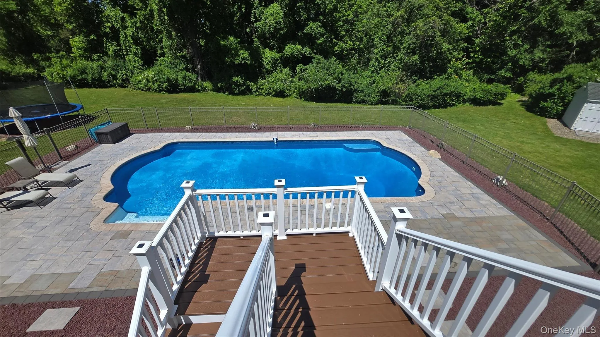 Trex Deck to Pool from main level. Trex Deck to Pool from main level.