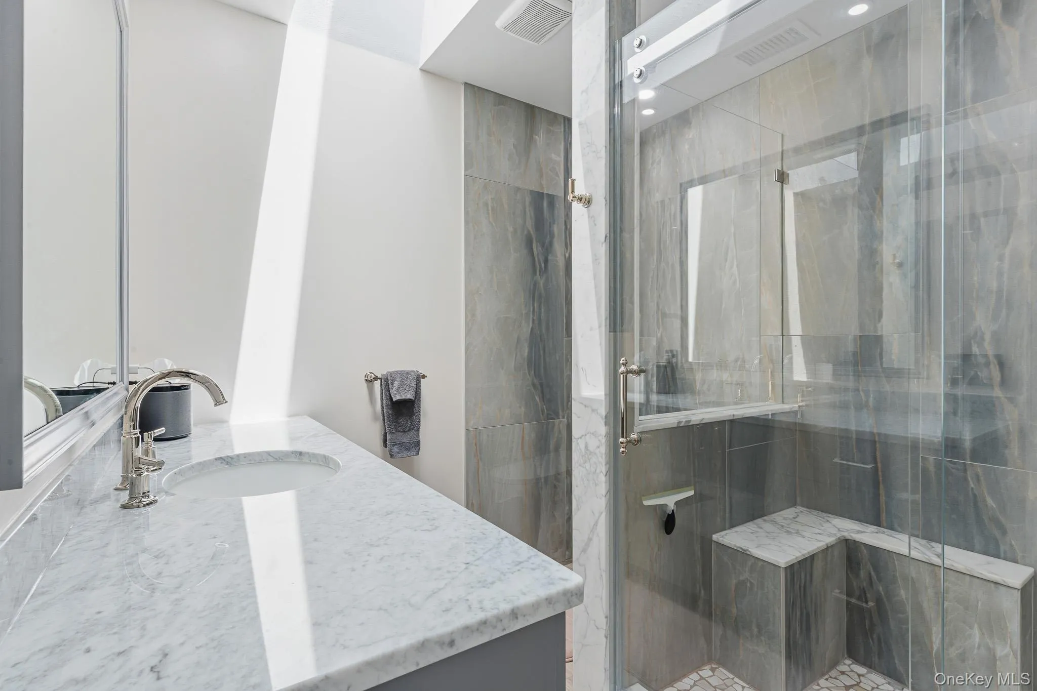 The Magnificent Primary Bathroom Has Been Gutted Down To The Studs & Offers A Spectacular Oversized Custom Shower With All 24" x 48" Stone Tiled Walls, Built In L Shaped Seat, Pebble Stone Style Floor, Wheeled/Rolling Frameless Glass Doors, High End Shower Fittings, Separate Commode Area With Fully Stone Tiled Walls, Stone Topped Handmade Custom Vanity, Wide Length Porcelain Plank Tile Floors, Skylight & All High End Details/Trims. The Magnificent Primary Bathroom Has Been Gutted Down To The Studs & Offers A Spectacular Oversized Custom Shower With All 24" x 48" Stone Tiled Walls, Built In L Shaped Seat, Pebble Stone Style Floor, Wheeled/Rolling Frameless Glass Doors, High End Shower Fittings, Separate Commode Area With Fully Stone Tiled Walls, Stone Topped Handmade Custom Vanity, Wide Length Porcelain Plank Tile Floors, Skylight & All High End Details/Trims.