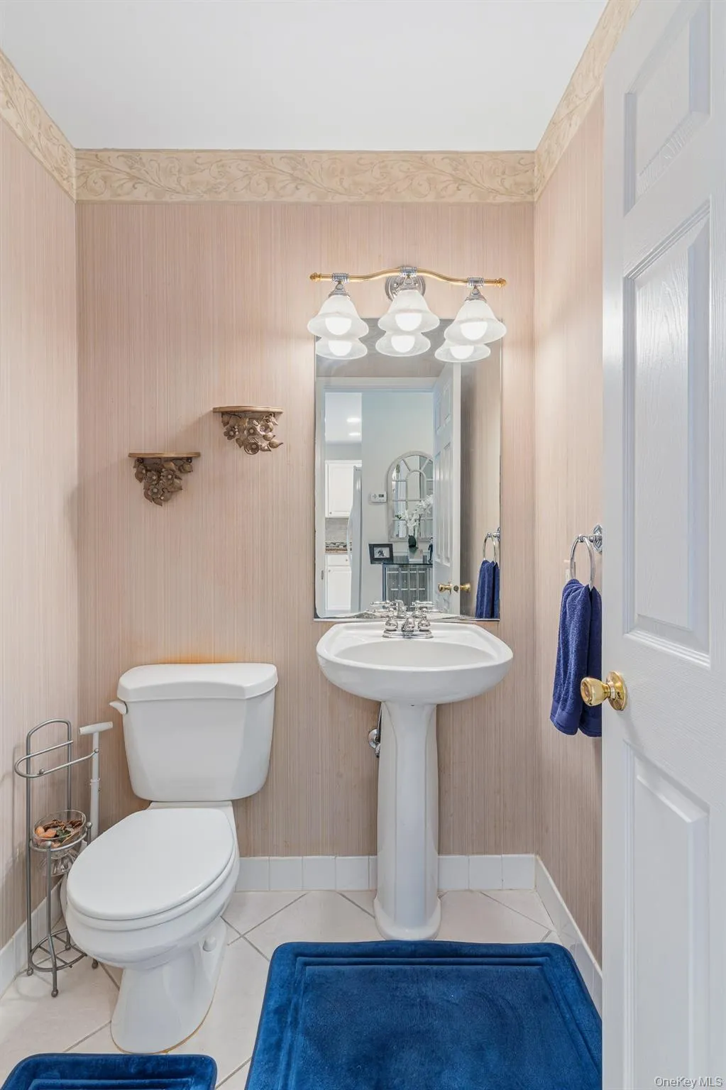 Off Of The Entrance Foyer Is A Lovely Powder Room/Half Bathroom With A Pedestal Sink, Diagonal Ceramic Tiled Floors & All Upgraded Fixtures. Off Of The Entrance Foyer Is A Lovely Powder Room/Half Bathroom With A Pedestal Sink, Diagonal Ceramic Tiled Floors & All Upgraded Fixtures.