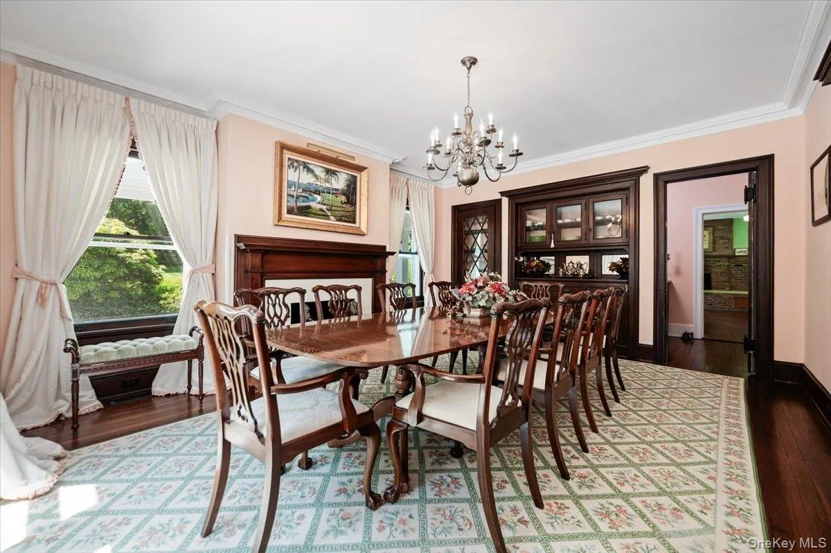 Formal and fabulous with wood burning fireplace, front and side facing windows, wood floors, moldings and swing door to butler's pantry Formal and fabulous with wood burning fireplace, front and side facing windows, wood floors, moldings and swing door to butler's pantry