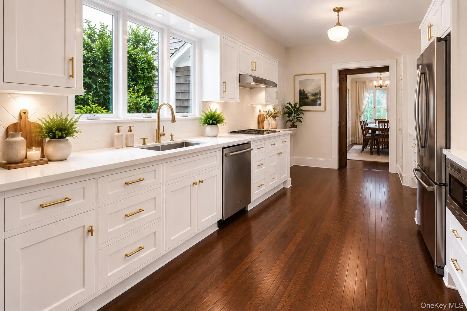 Staged - wood floors, granite counters, double oven and gas stove top Staged - wood floors, granite counters, double oven and gas stove top