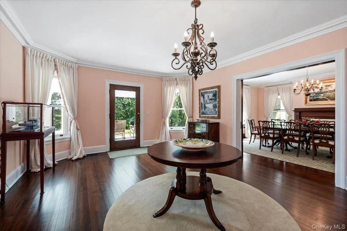Rich wood floors, high ceilings, base and ceiling moldings and paneled pocket doors Rich wood floors, high ceilings, base and ceiling moldings and paneled pocket doors
