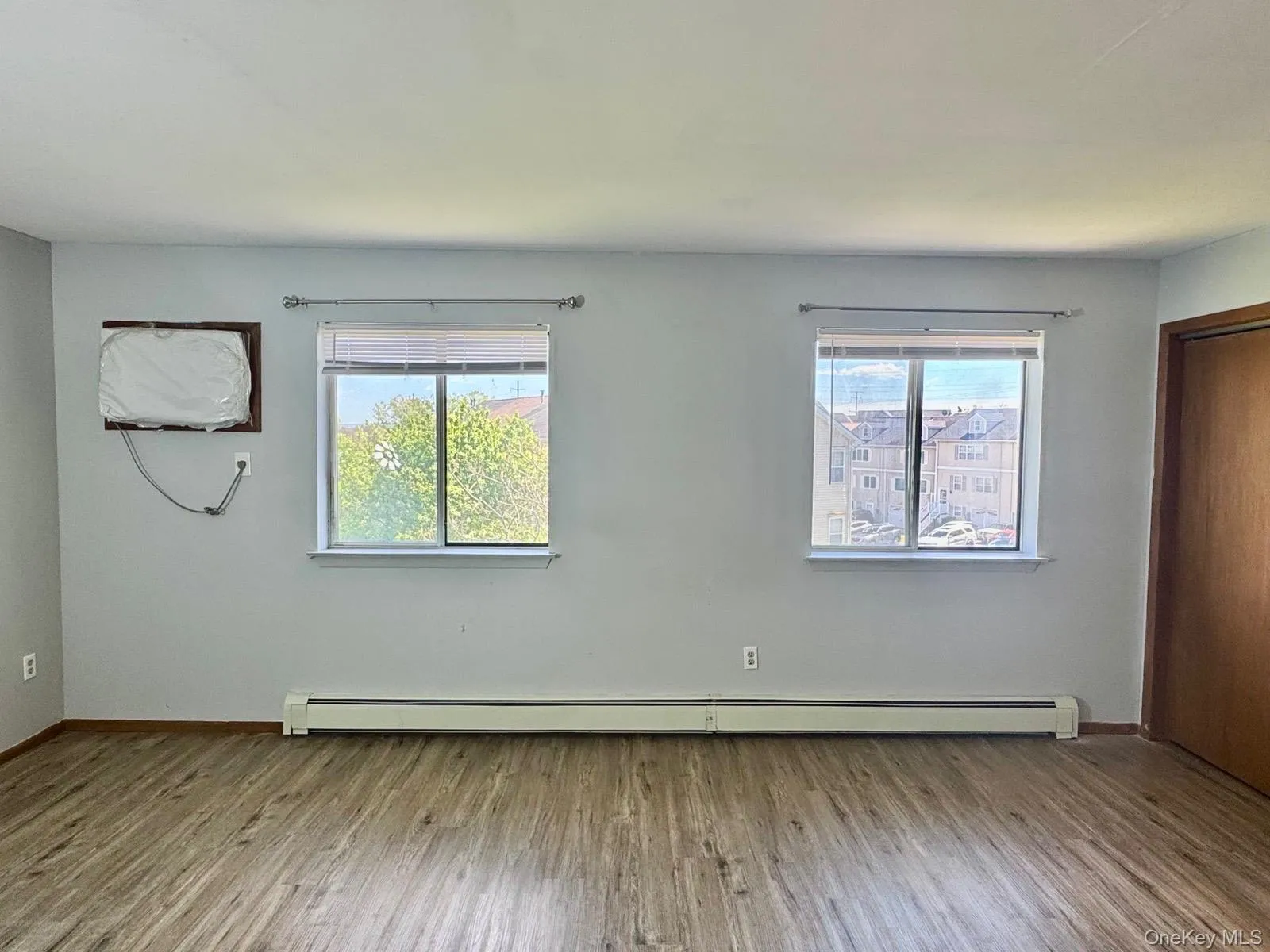 with a closet, wall air conditioner and two window with a lot of sunlight coming in. with a closet, wall air conditioner and two window with a lot of sunlight coming in.