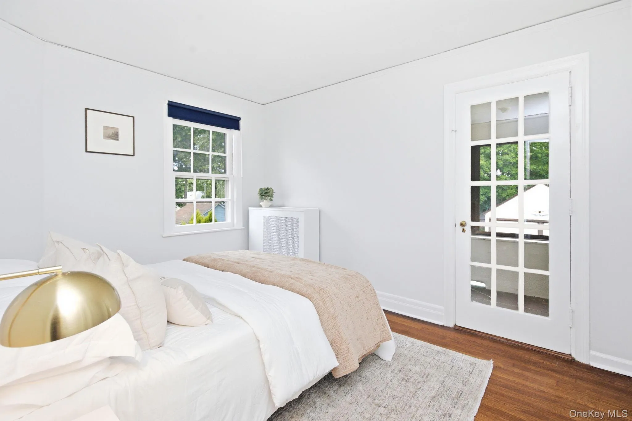 This second floor bedroom opens through a French door to its own summer porch. This second floor bedroom opens through a French door to its own summer porch.