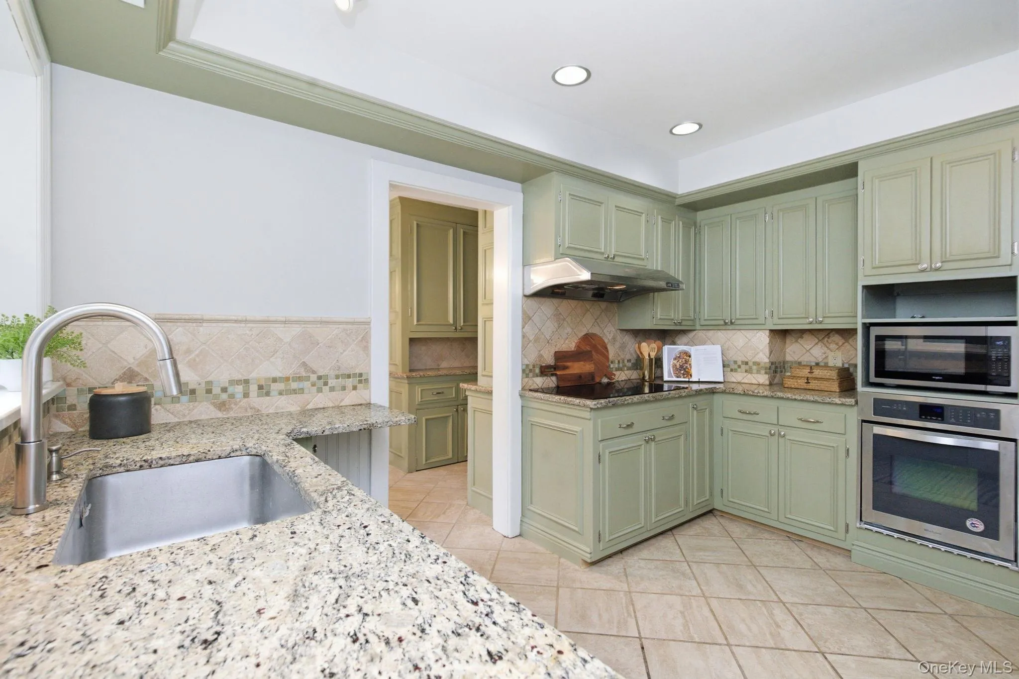 An abundance of cabinets keeps everything within easy reach in the kitchen. An abundance of cabinets keeps everything within easy reach in the kitchen.