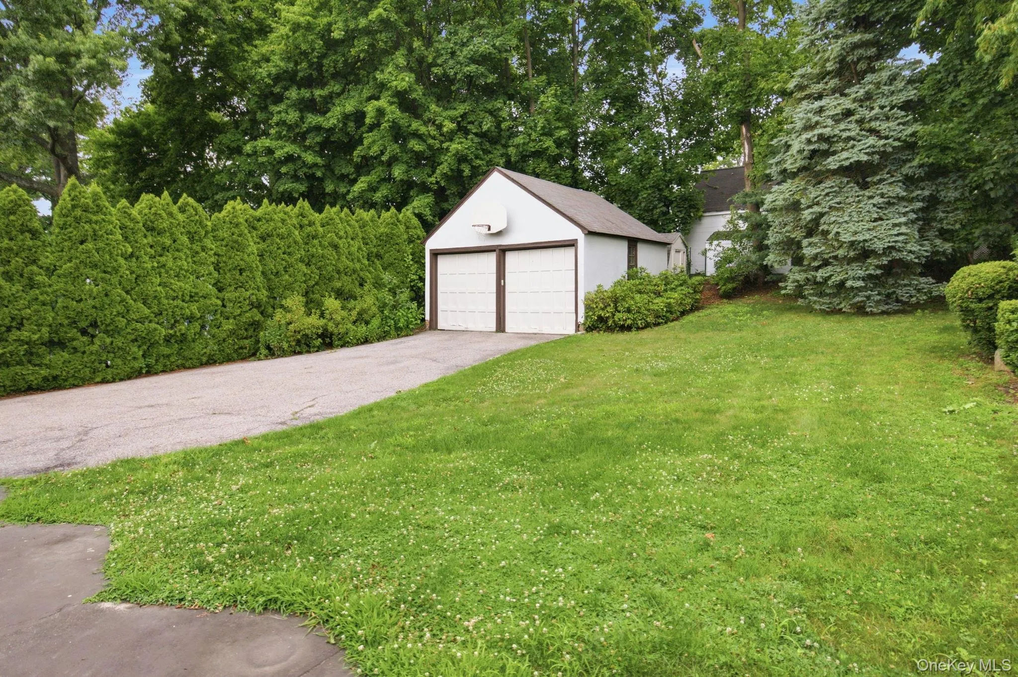The garage offers space for two cars with room to spare. The garage offers space for two cars with room to spare.