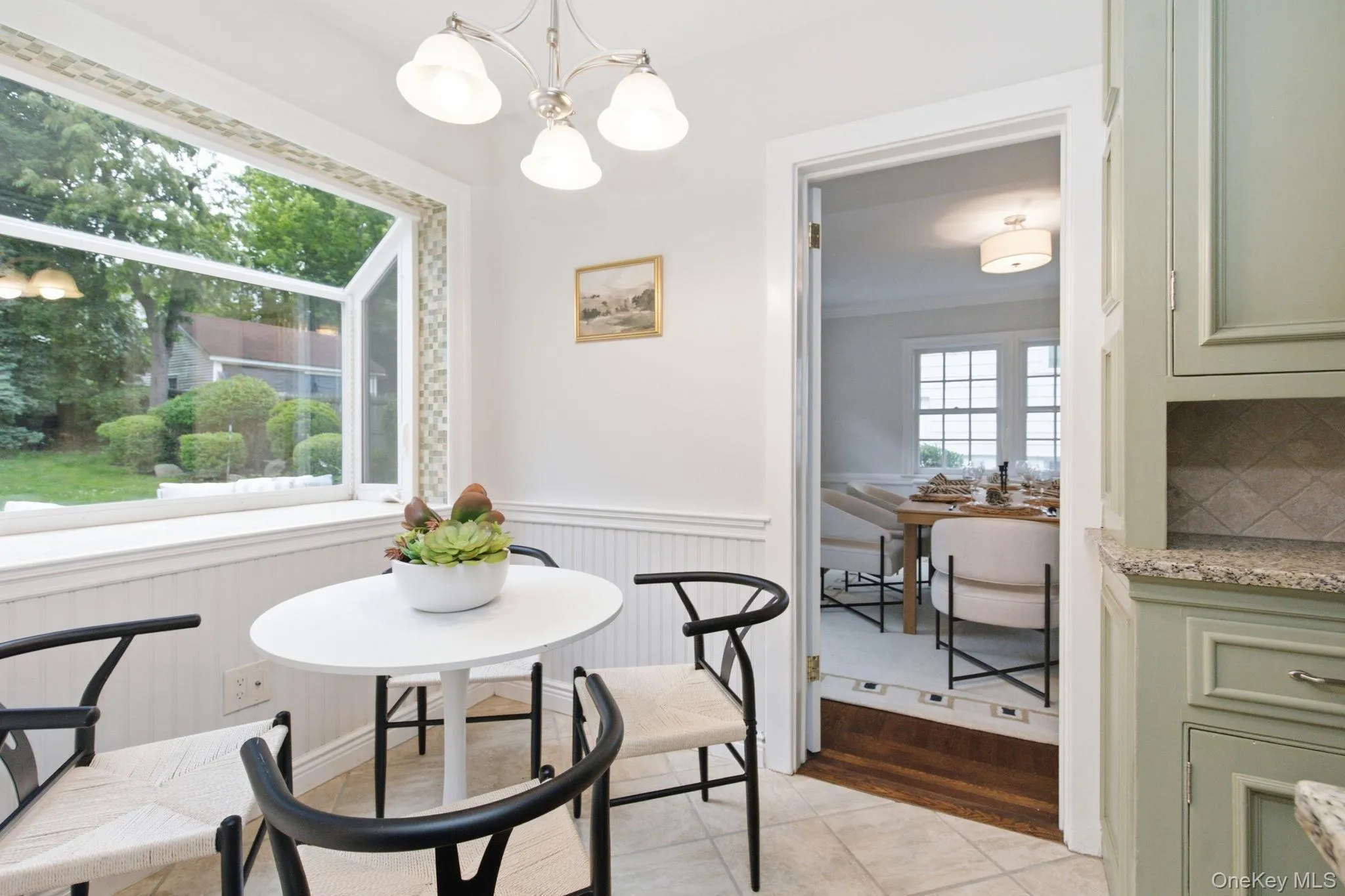 The breakfast room's garden window brings the backyard greenery inside. The breakfast room's garden window brings the backyard greenery inside.