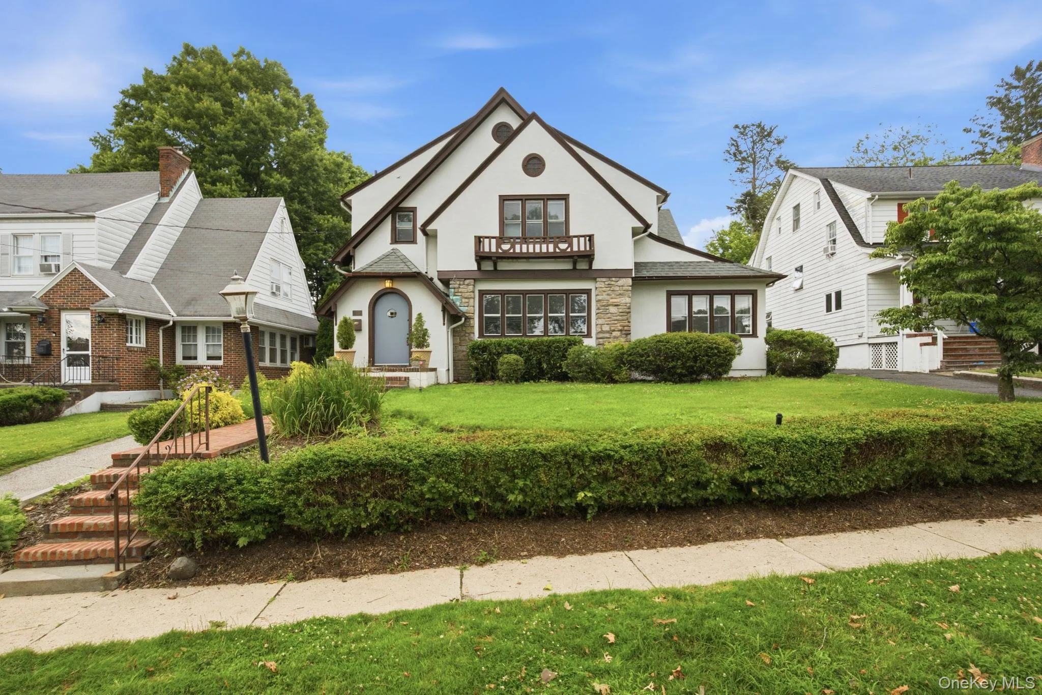 Perennial gardens and mature hedges frame the picture-perfect facade. Perennial gardens and mature hedges frame the picture-perfect facade.