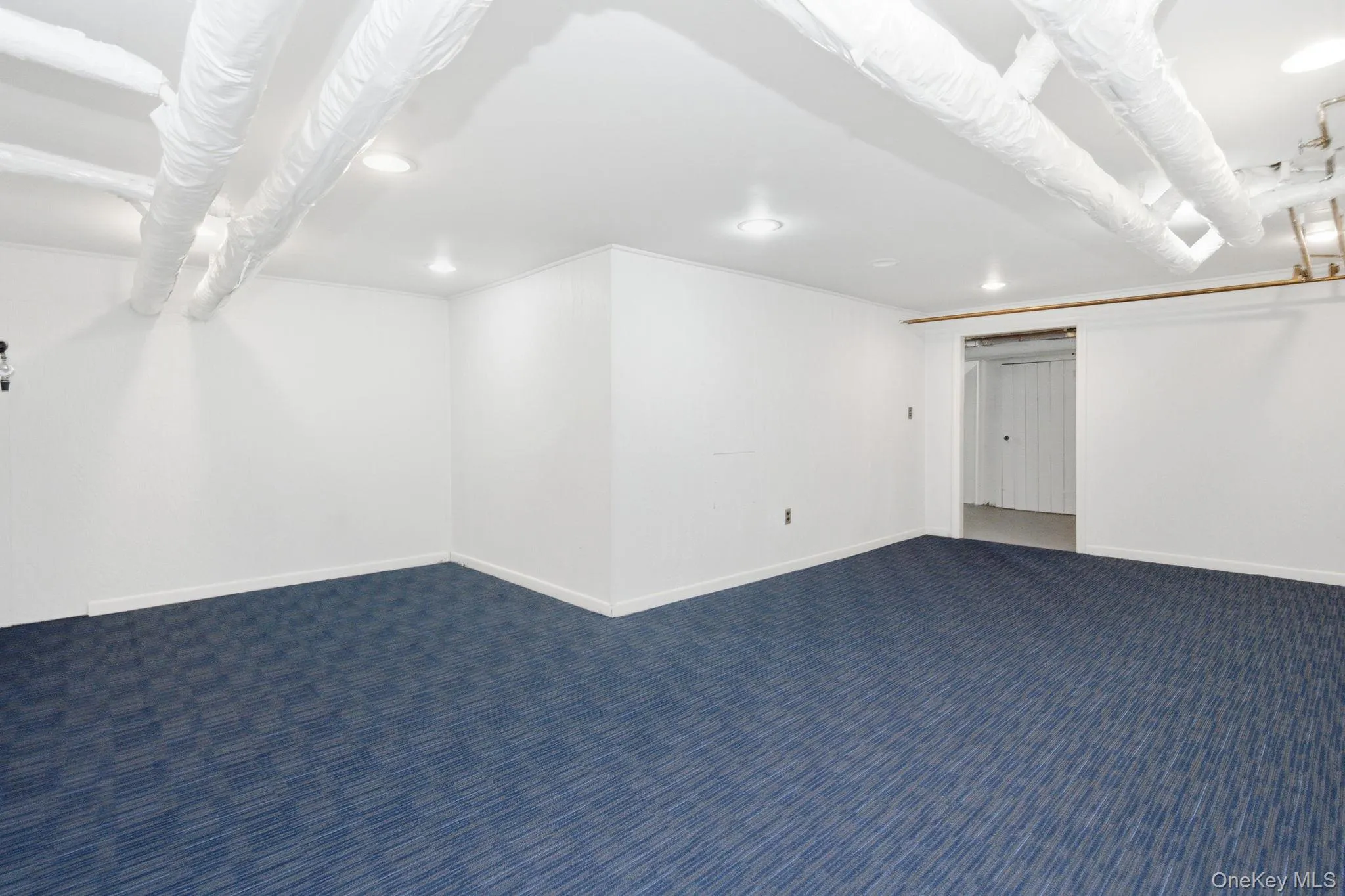 New carpet refreshes the lower level family room, ready for movie nights and playtime. New carpet refreshes the lower level family room, ready for movie nights and playtime.