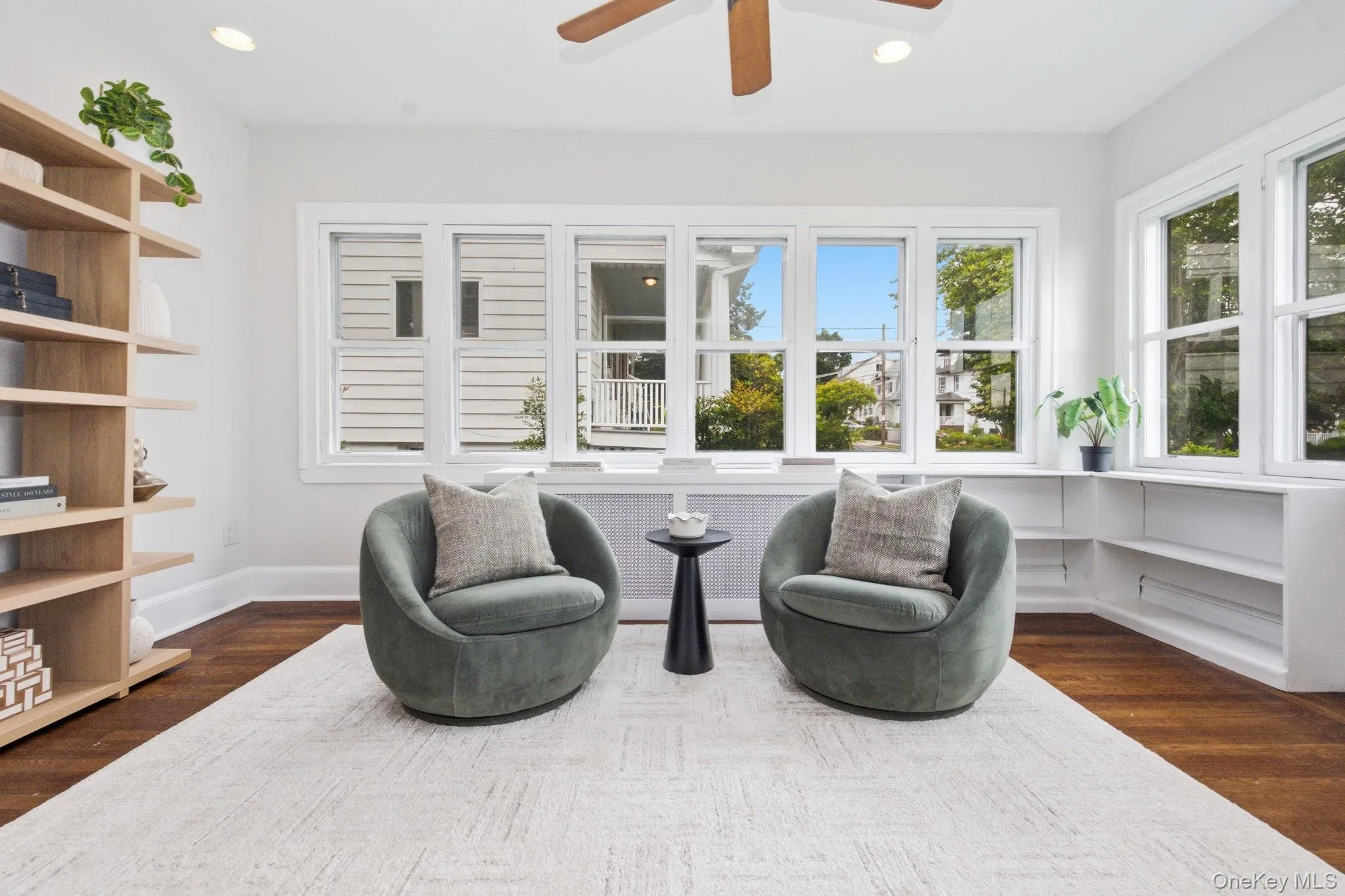 Two walls of windows and built-in shelving make this an ideal home office. Two walls of windows and built-in shelving make this an ideal home office.