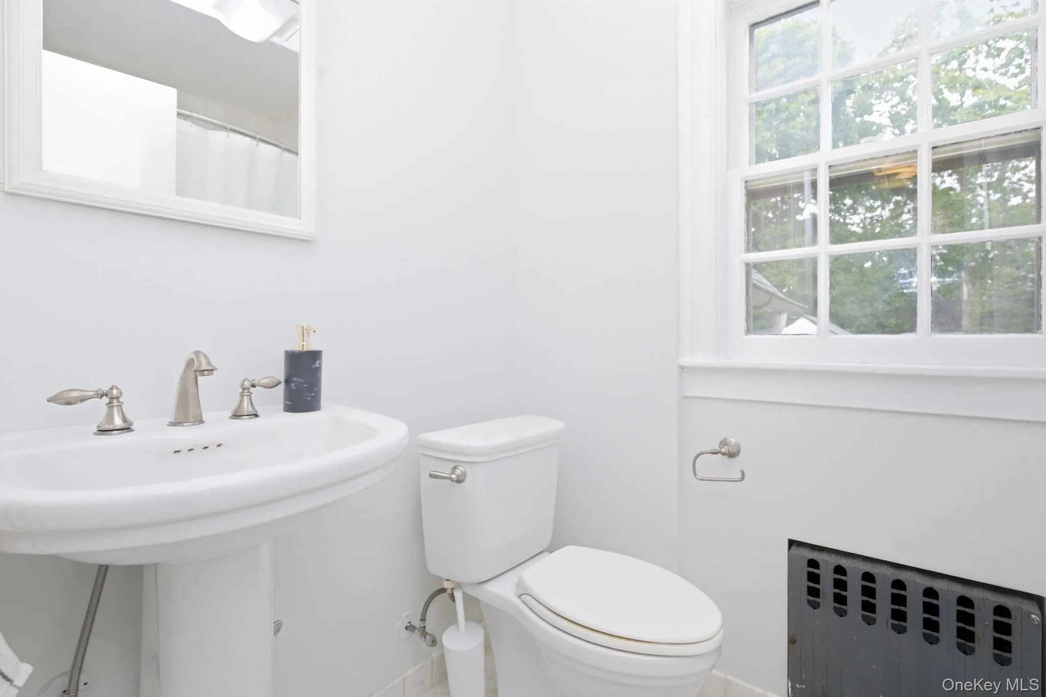 The updated full bathroom serves the second floor's bedrooms. The updated full bathroom serves the second floor's bedrooms.