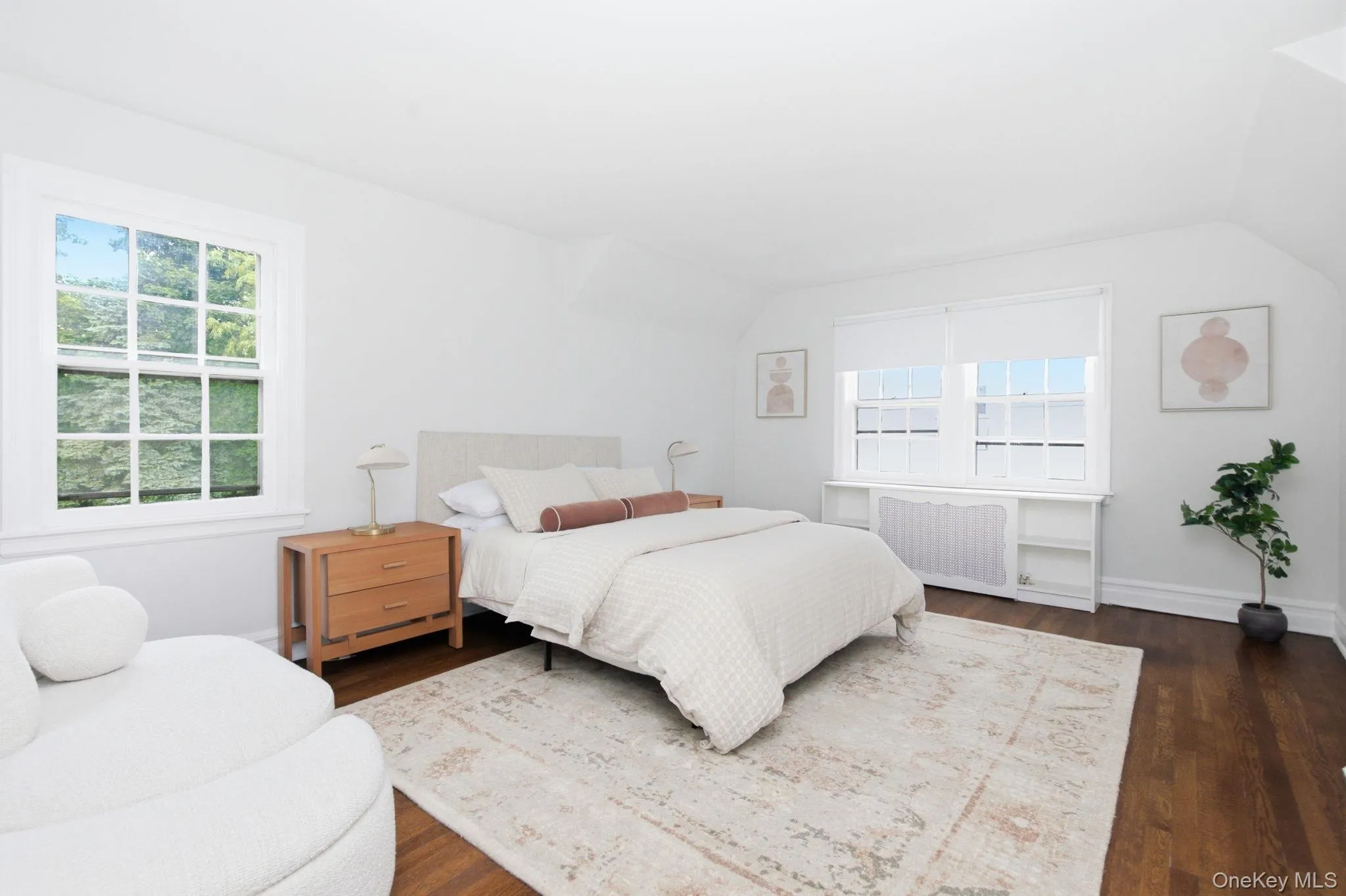 This wood floored bedroom offers two closets and treetop views. This wood floored bedroom offers two closets and treetop views.