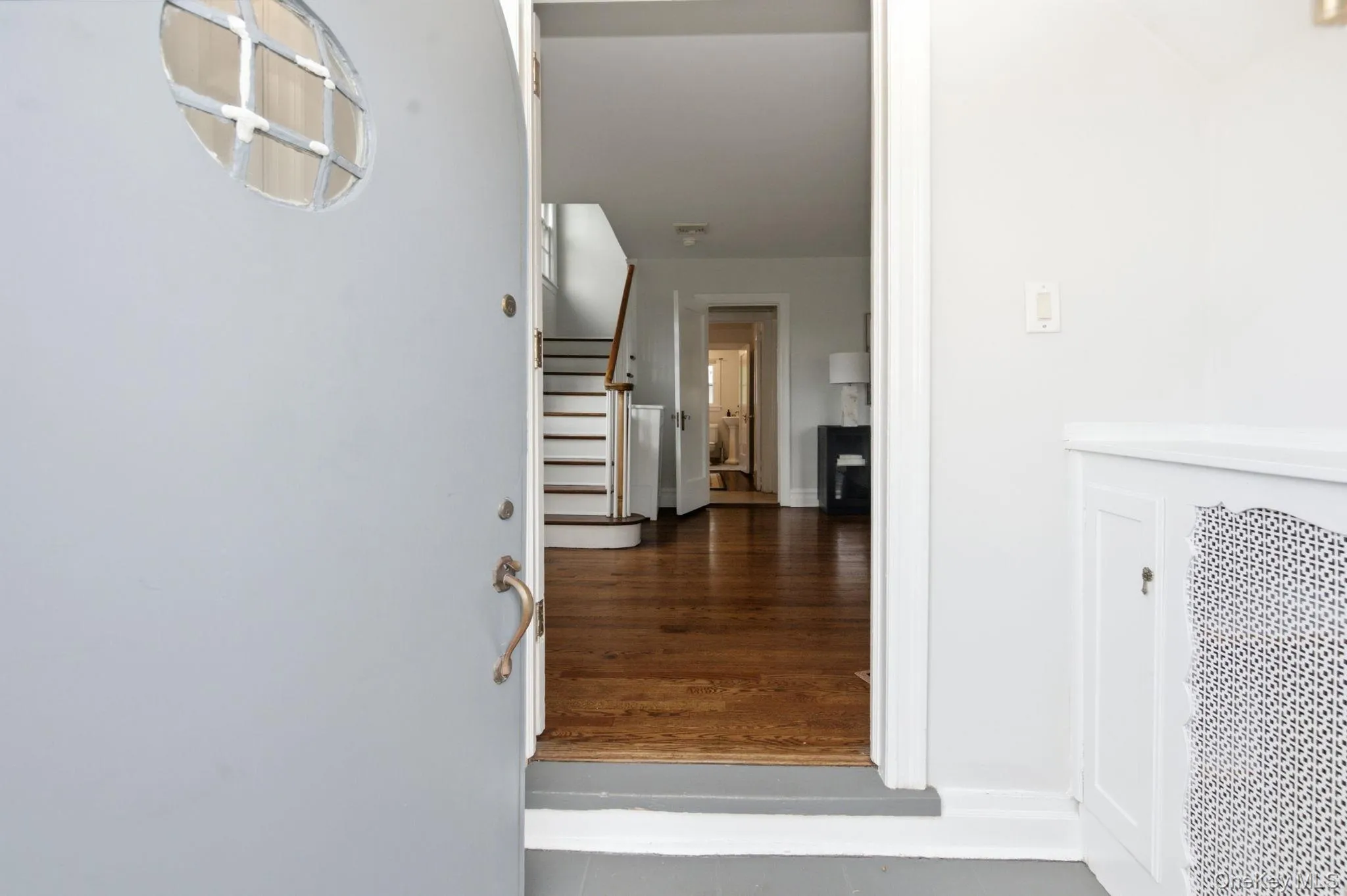 The arched entry door with its porthole window sets the tone before you even step inside. The arched entry door with its porthole window sets the tone before you even step inside.