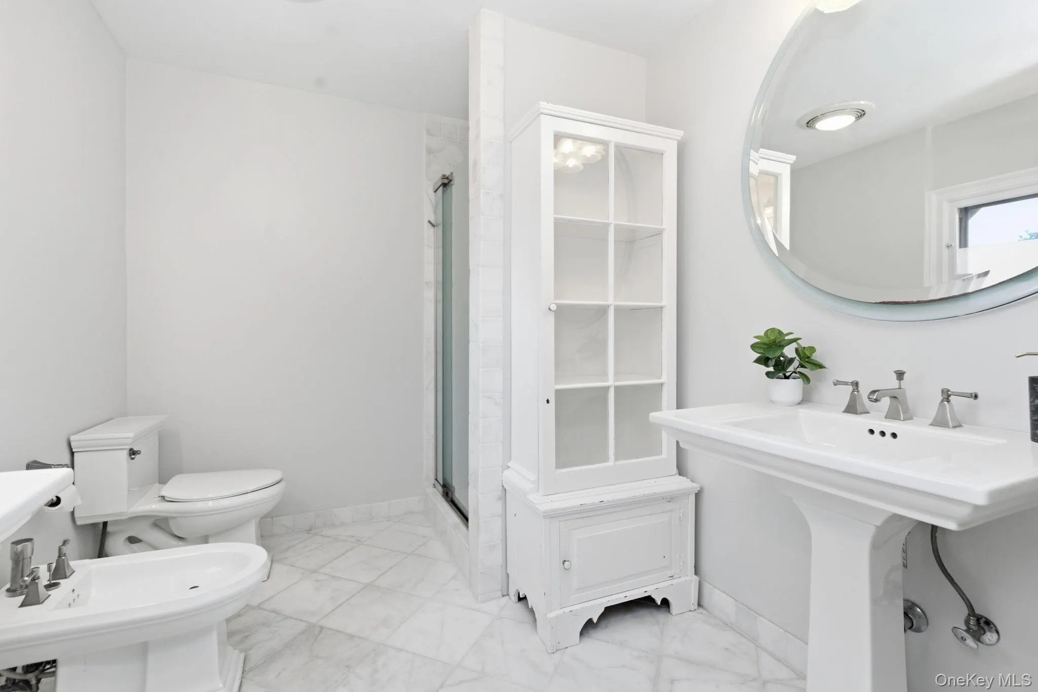 A bidet and built-in cabinet complete the ensuite in European style. A bidet and built-in cabinet complete the ensuite in European style.