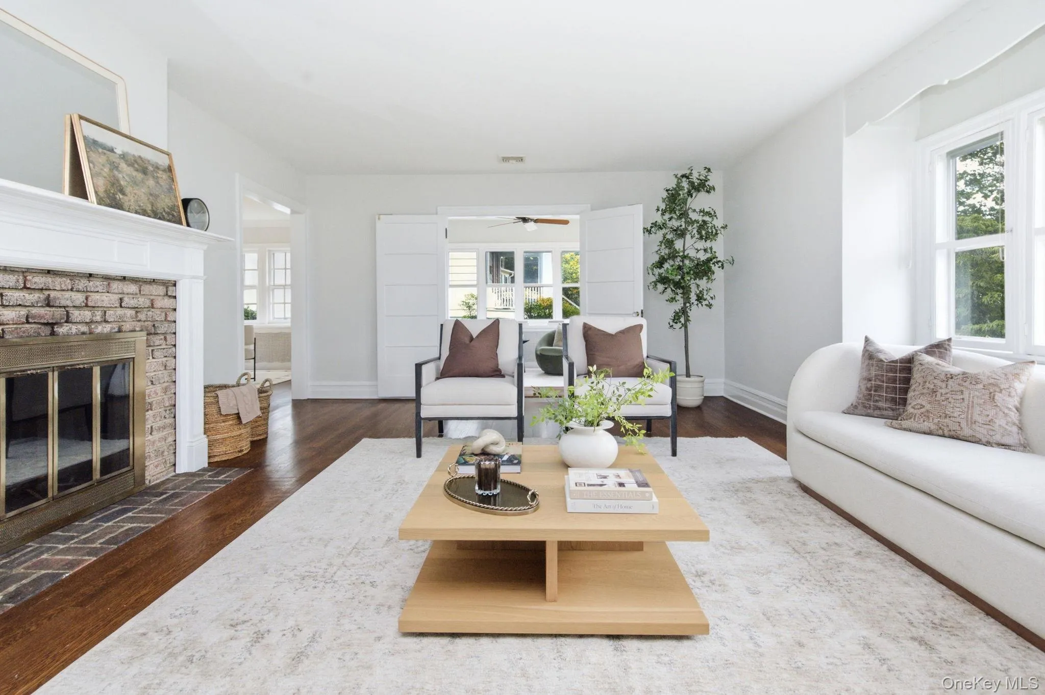 Paneled double doors open from the living room to the sun room. Paneled double doors open from the living room to the sun room.