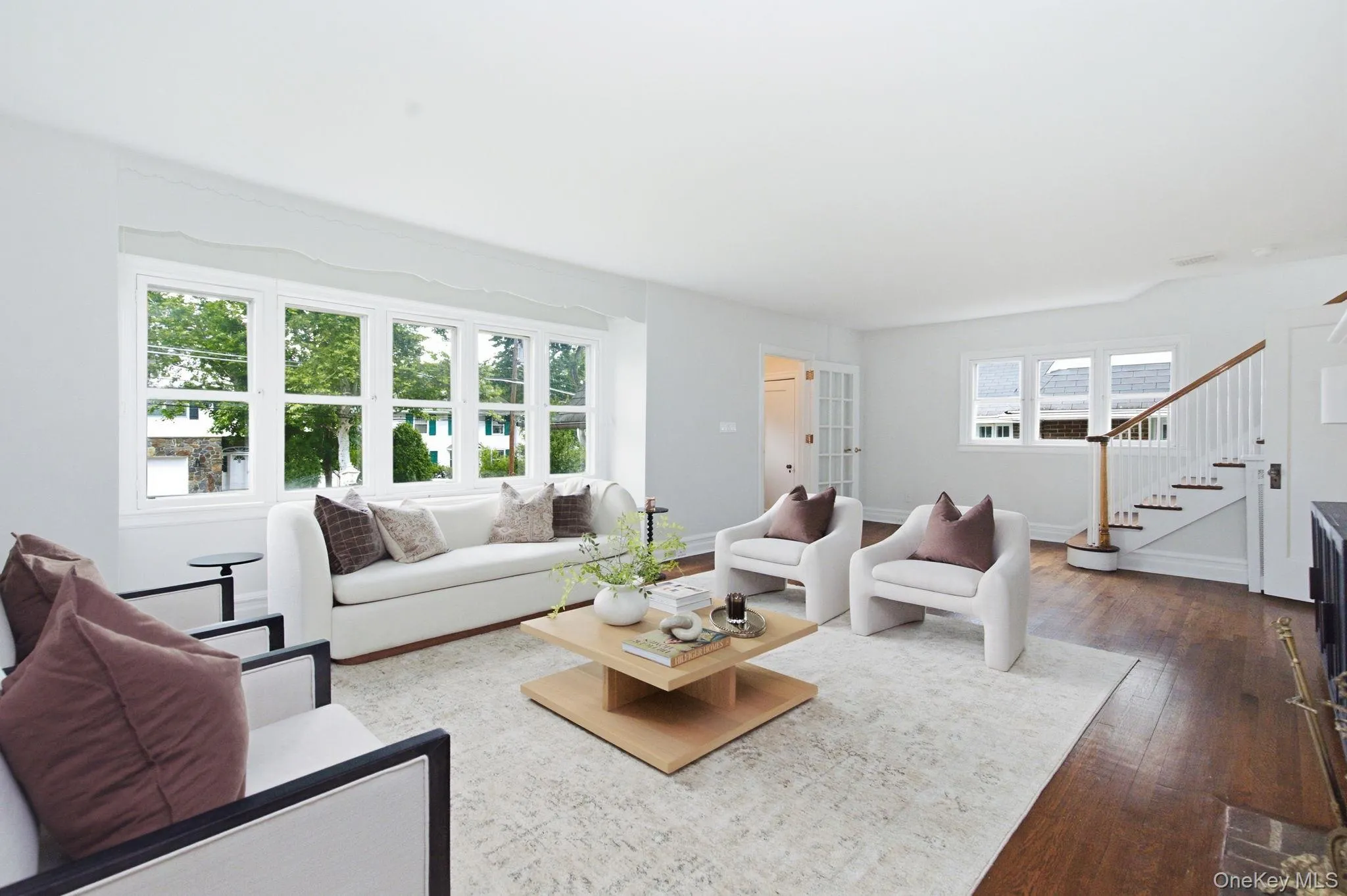 Front-facing windows stretch nearly wall to wall, drenching the space in daylight. Front-facing windows stretch nearly wall to wall, drenching the space in daylight.