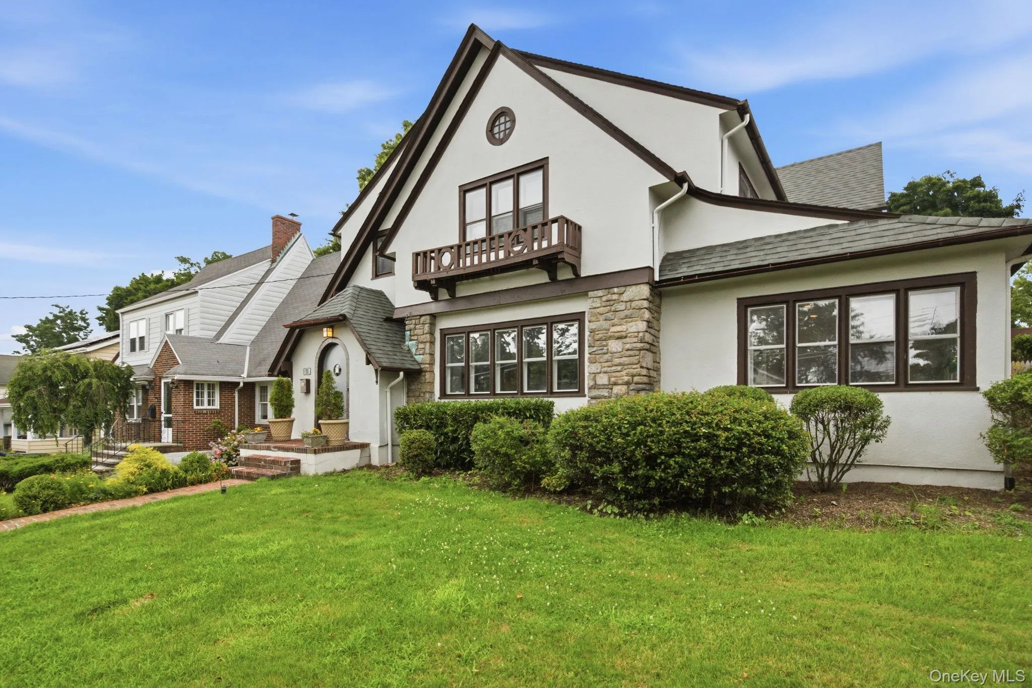 Fresh landscaping and a welcoming front lawn boost curb appeal on this sidewalk lined street. Fresh landscaping and a welcoming front lawn boost curb appeal on this sidewalk lined street.