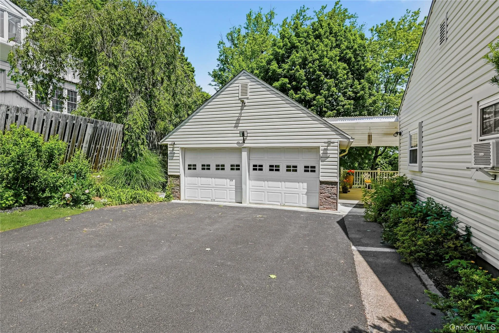 Spacious 2 car detached garage with additional attic storage. Spacious 2 car detached garage with additional attic storage.
