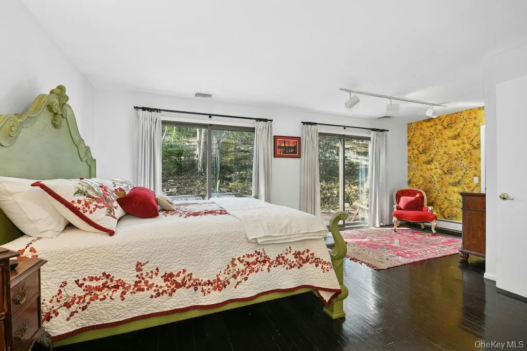 features sliding doors to private deck, walk-in closet, wood floors features sliding doors to private deck, walk-in closet, wood floors