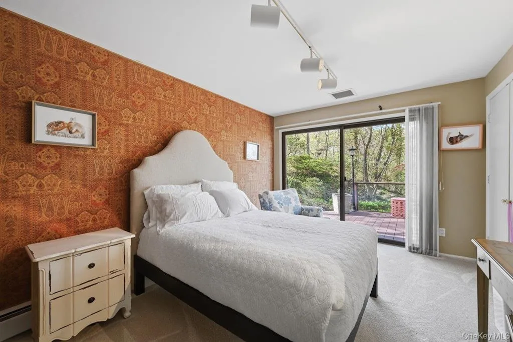 Second bedroom with sliding doors to private deck and beautiful views Second bedroom with sliding doors to private deck and beautiful views