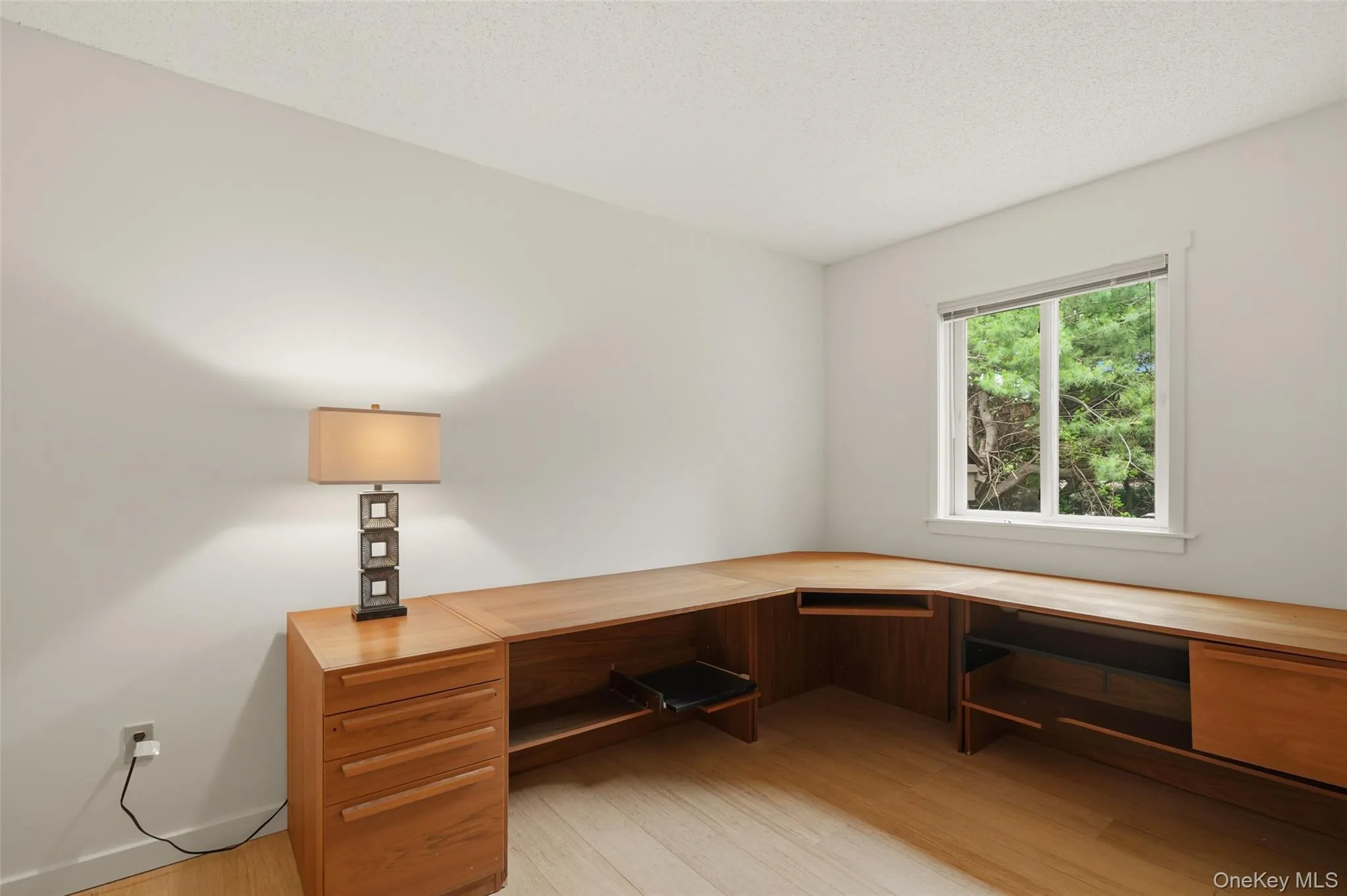 Den off of the living room with built-in desk. Den off of the living room with built-in desk.