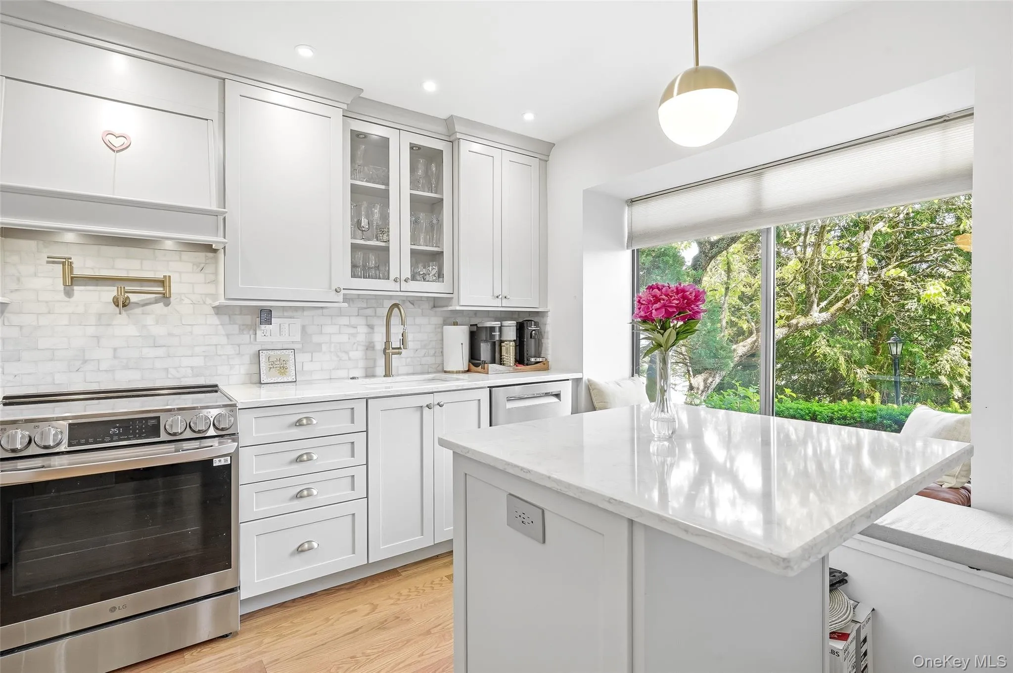 Beautiful picture window in kitchen with natural light Beautiful picture window in kitchen with natural light