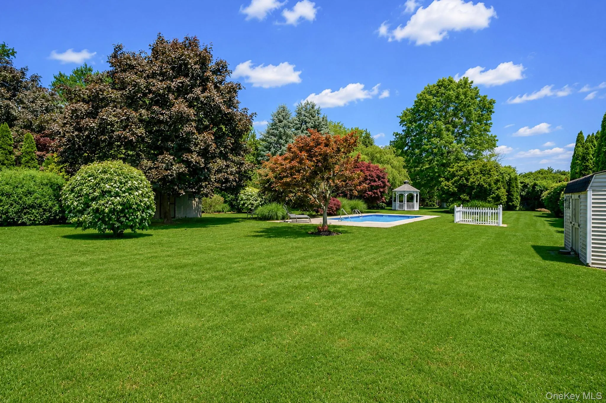 Oasis of a yard that offers plenty of space beyond the inground pool Oasis of a yard that offers plenty of space beyond the inground pool