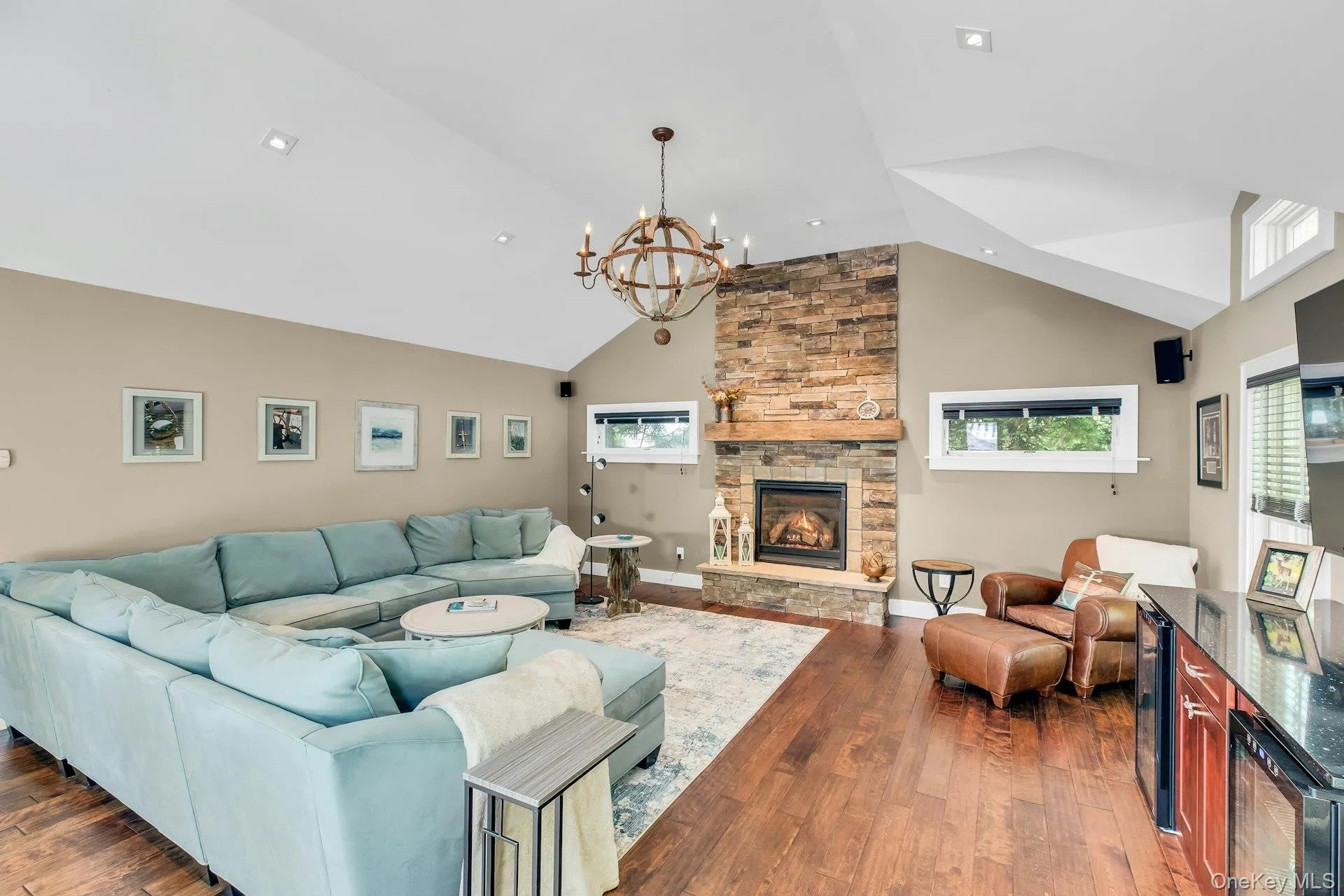 Grand den with cathedral ceilings with deck leading to back yard oasis Grand den with cathedral ceilings with deck leading to back yard oasis