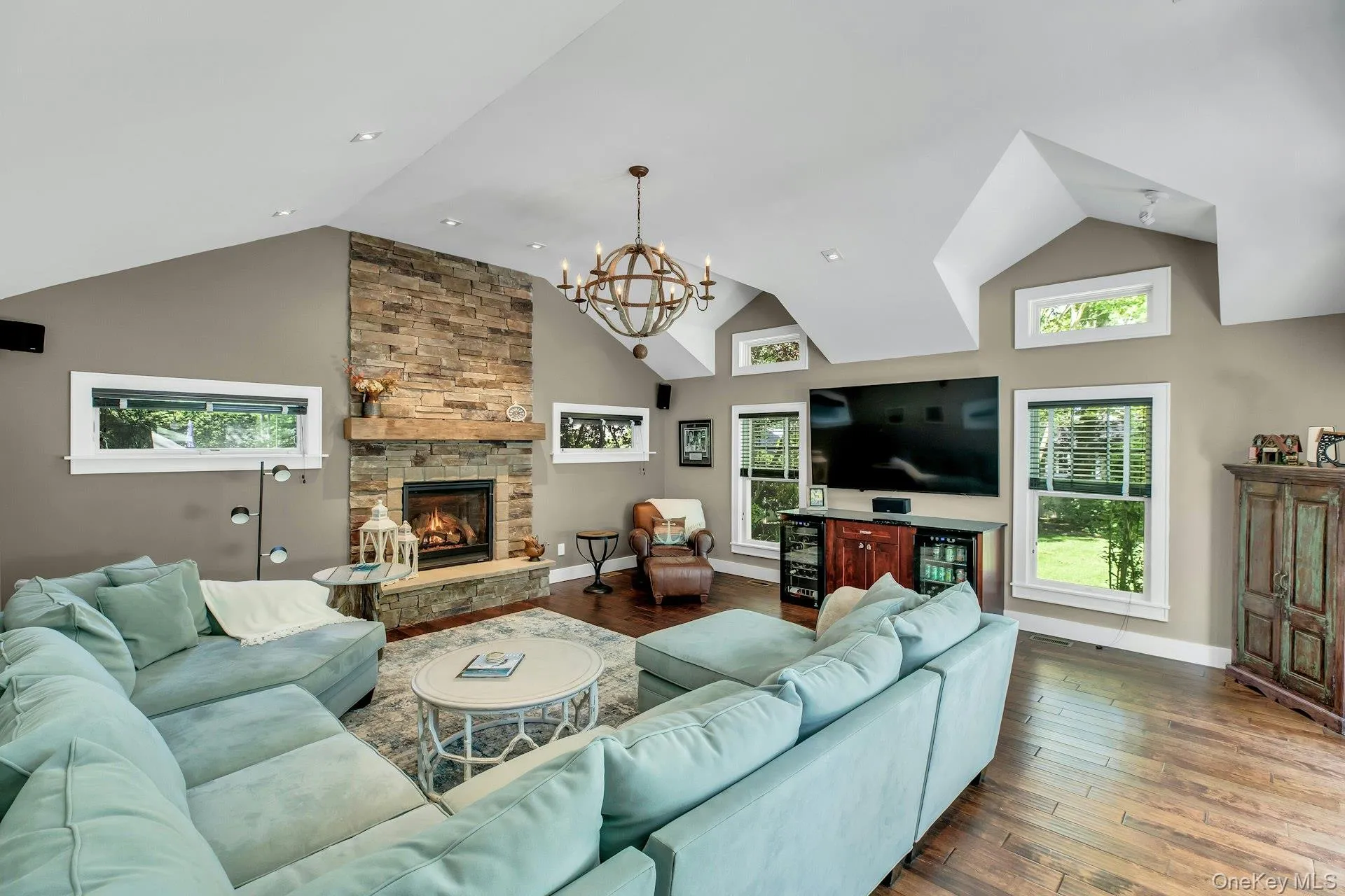 Grand den with cathedral ceilings with deck leading to back yard oasis Grand den with cathedral ceilings with deck leading to back yard oasis