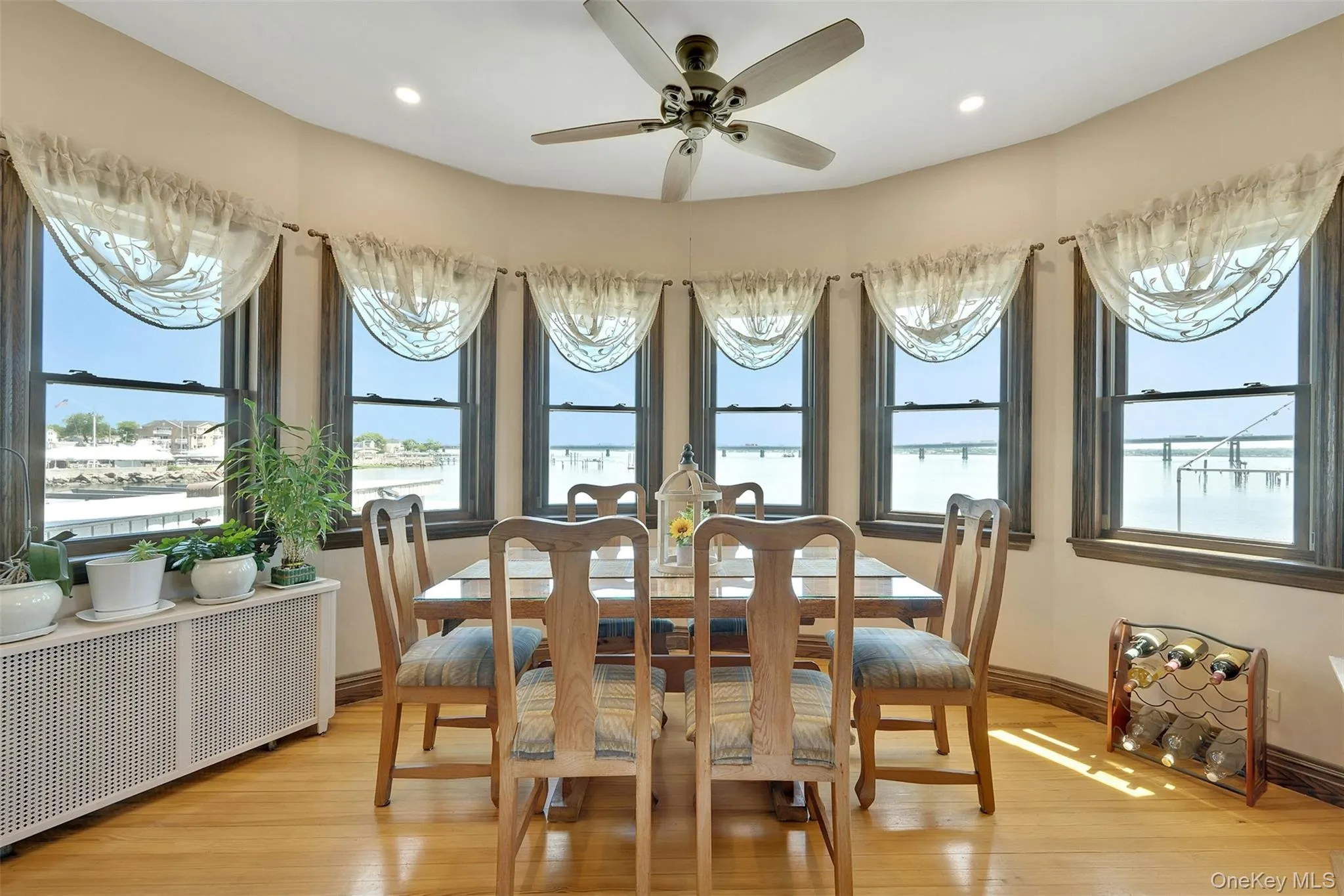 Dining room surrounded by Hurricane Windows and breathtaking views Dining room surrounded by Hurricane Windows and breathtaking views