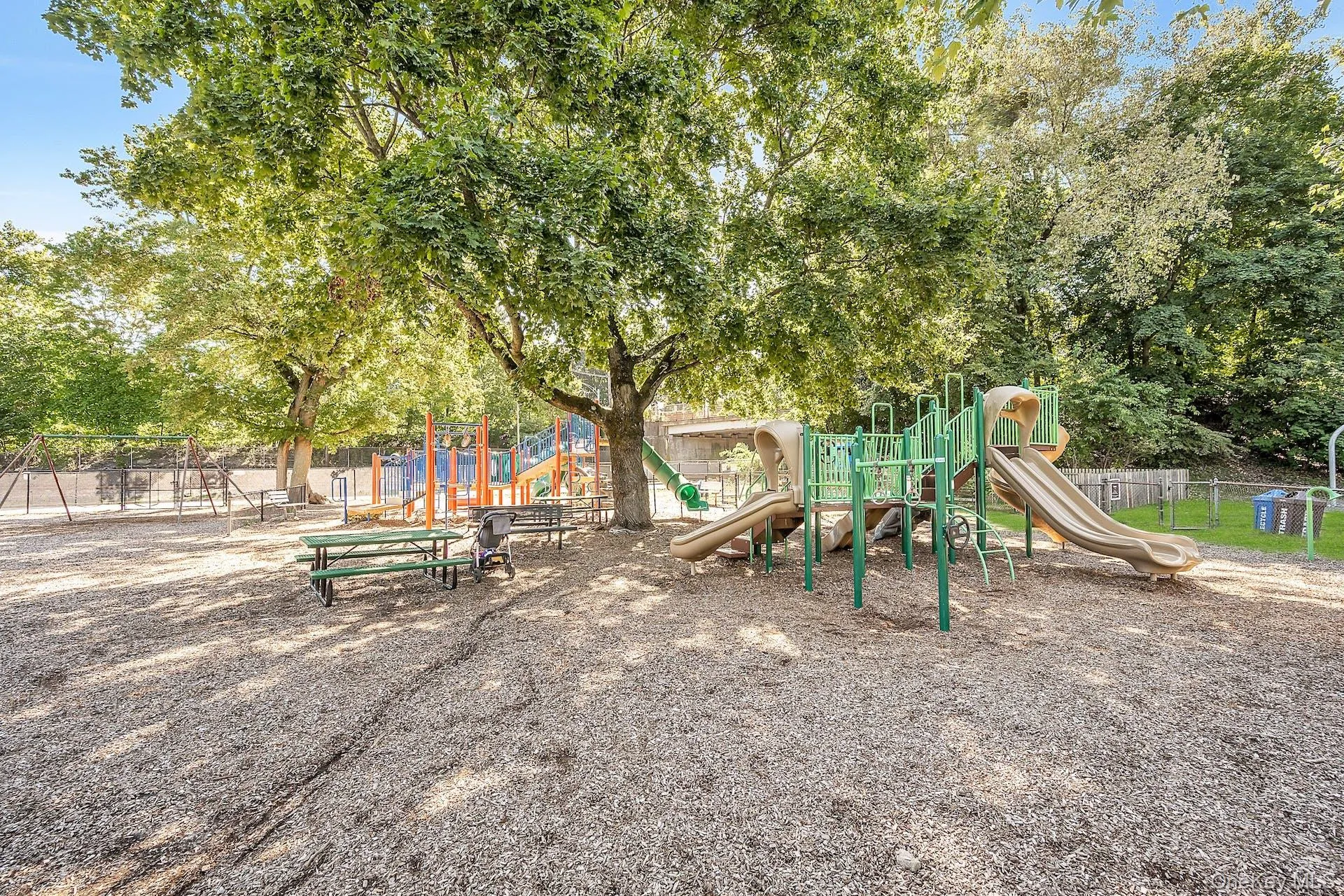 Communal playground featuring fence Communal playground featuring fence
