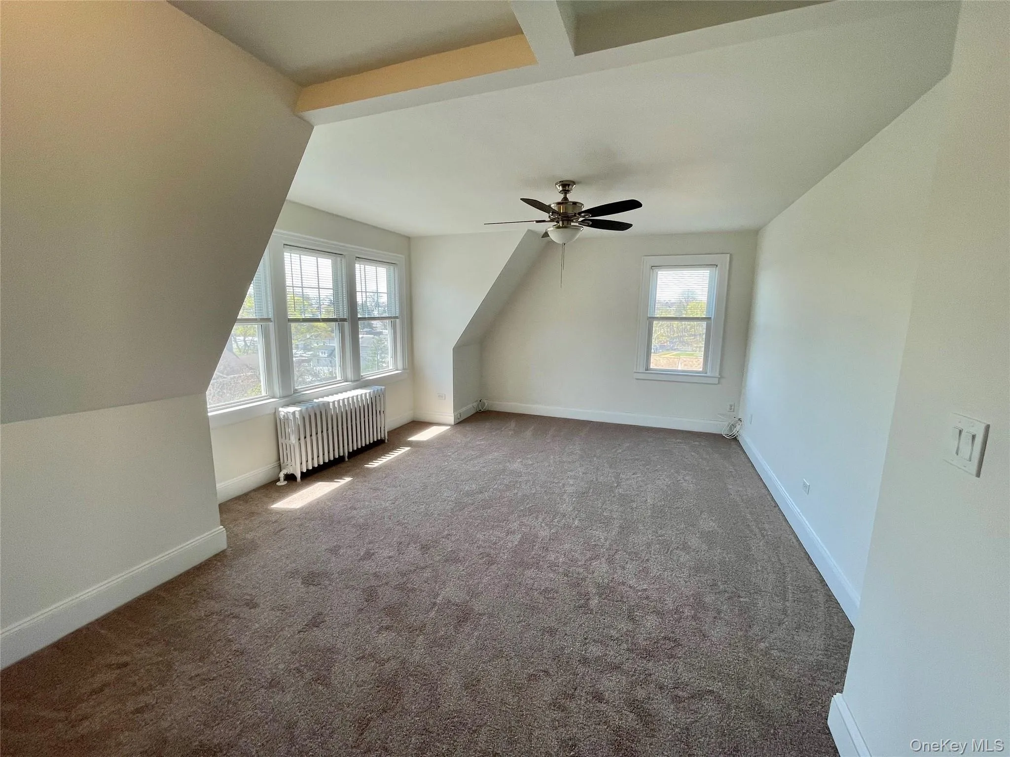 Wider view of living room...new carpeting throughout and freshly painted Wider view of living room...new carpeting throughout and freshly painted
