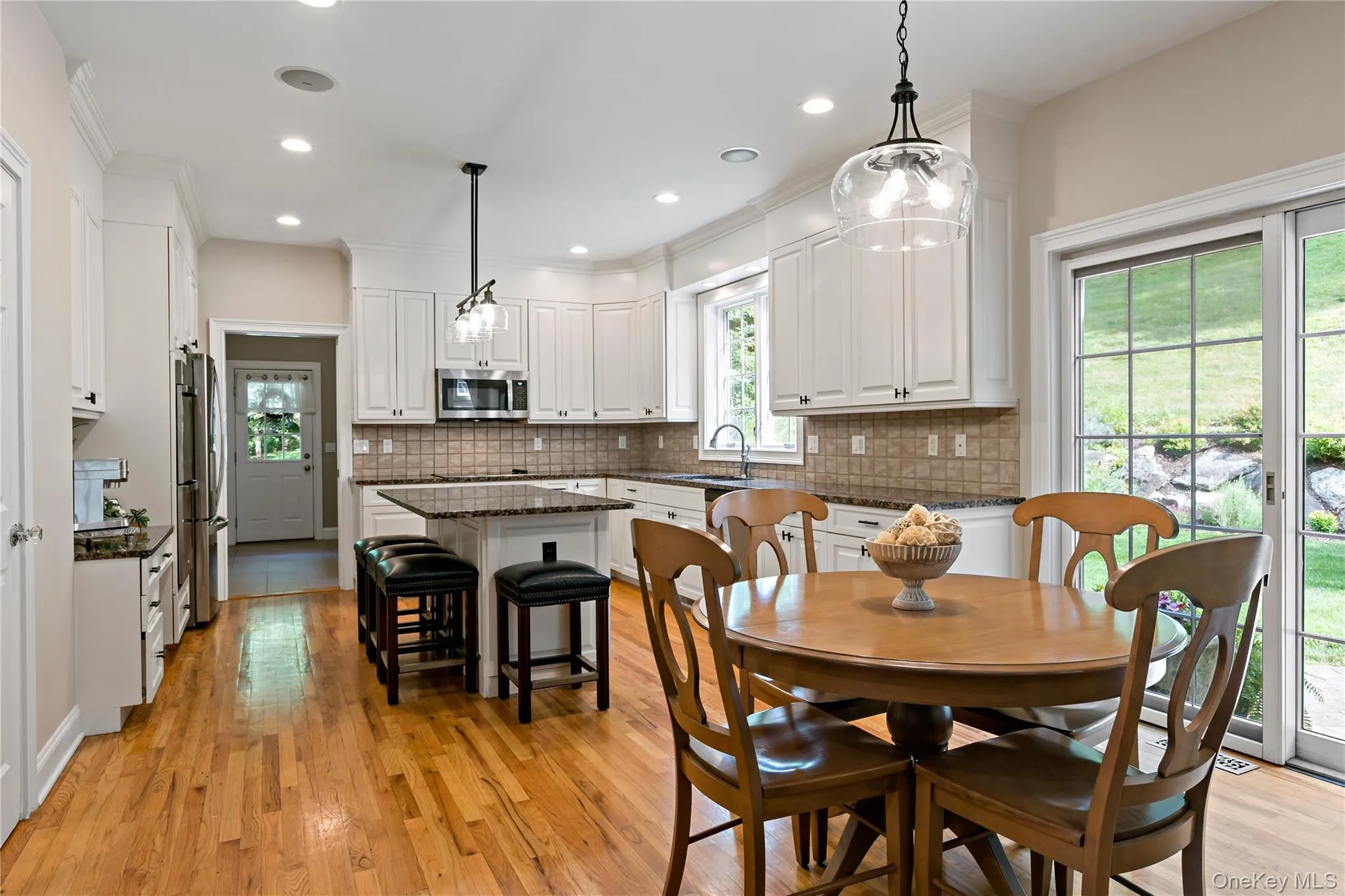 Eat in area of the kitchen with sliders out to terrace. Eat in area of the kitchen with sliders out to terrace.