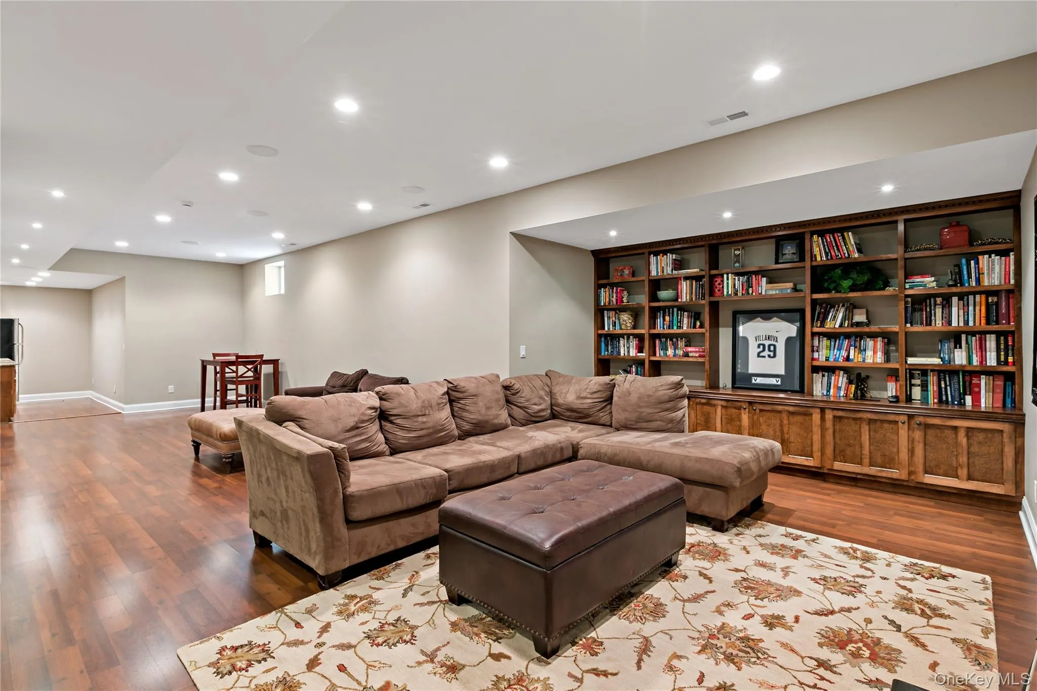 Family room with custom built ins and room for a ping pong table. Family room with custom built ins and room for a ping pong table.