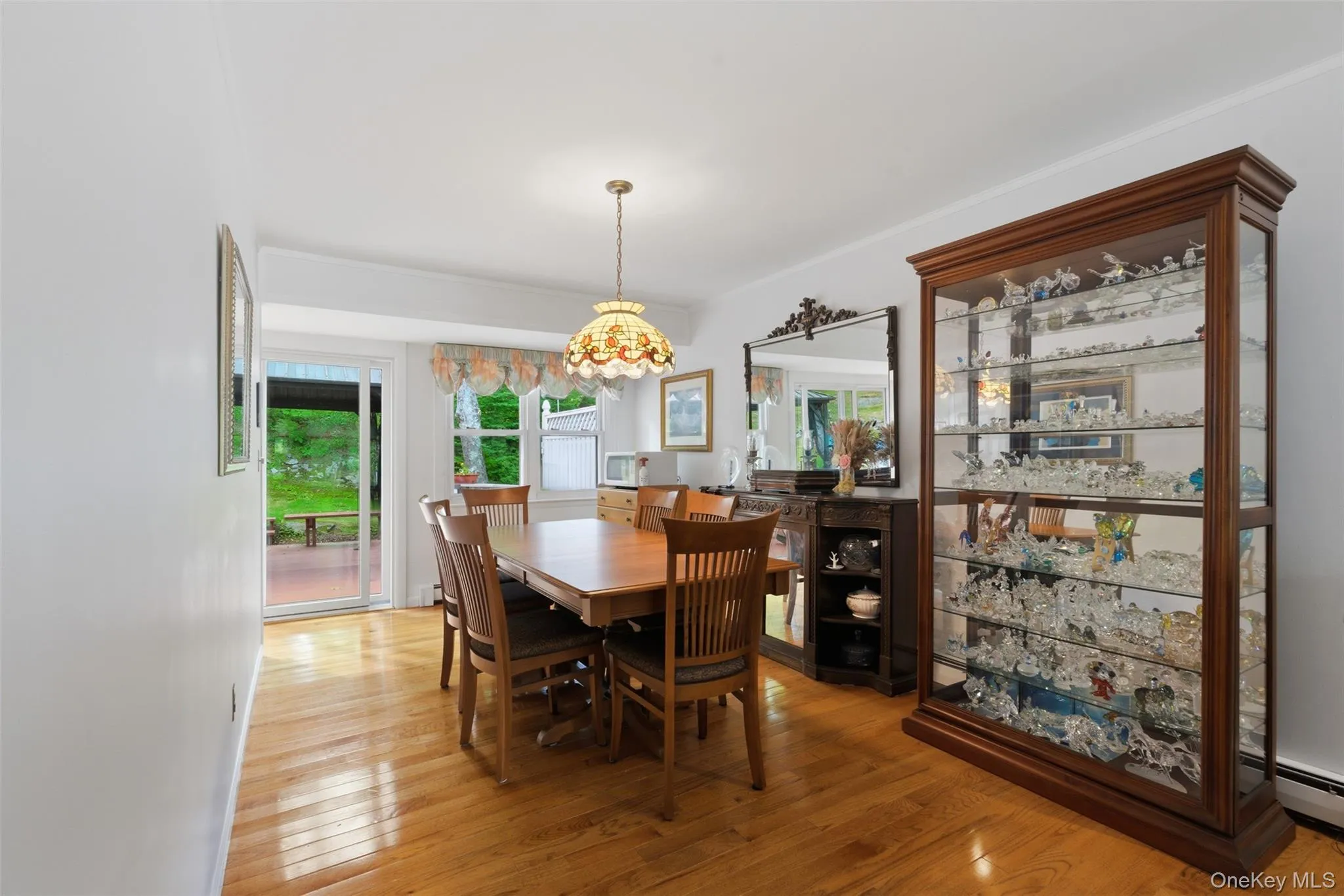 Formal dining room, with sliders out to the beautiful deck Formal dining room, with sliders out to the beautiful deck