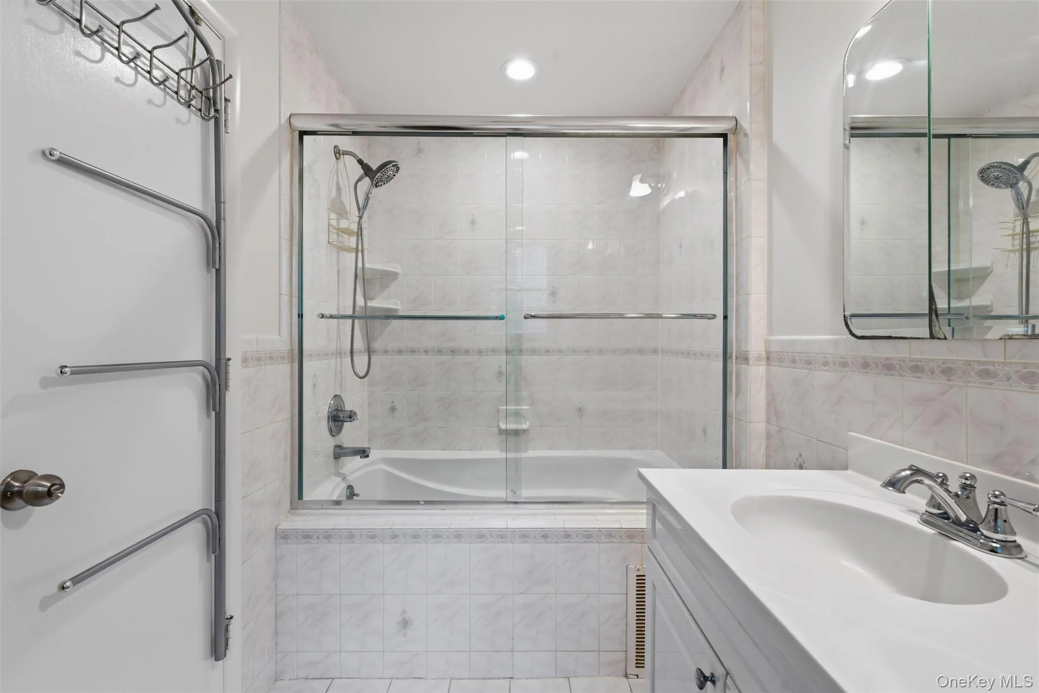 Elegantly appointed primary bath with beautiful tilework and Jacuzzi tub Elegantly appointed primary bath with beautiful tilework and Jacuzzi tub