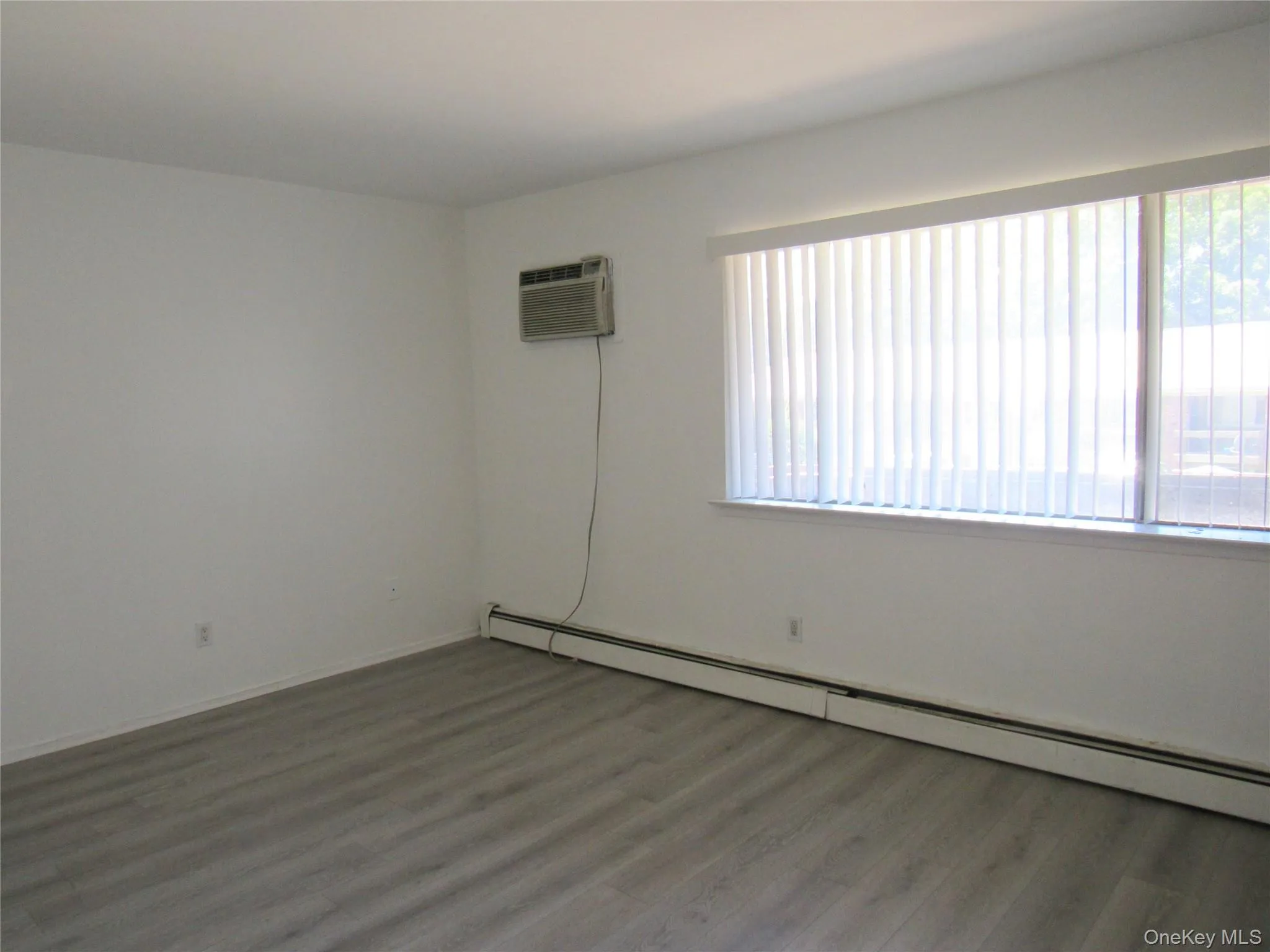 In wall unit air conditioner in primary bedroom In wall unit air conditioner in primary bedroom