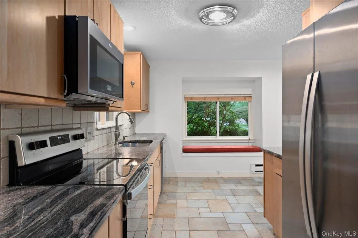 Walkthrough Kitchen with stainless steel appliances, cabinet underlighting, plenty of counter and cabinet space Walkthrough Kitchen with stainless steel appliances, cabinet underlighting, plenty of counter and cabinet space