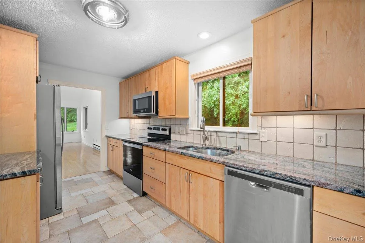 Kitchen with stainless steel appliances, cabinet underlighting, plenty of counter and cabinet space Kitchen with stainless steel appliances, cabinet underlighting, plenty of counter and cabinet space