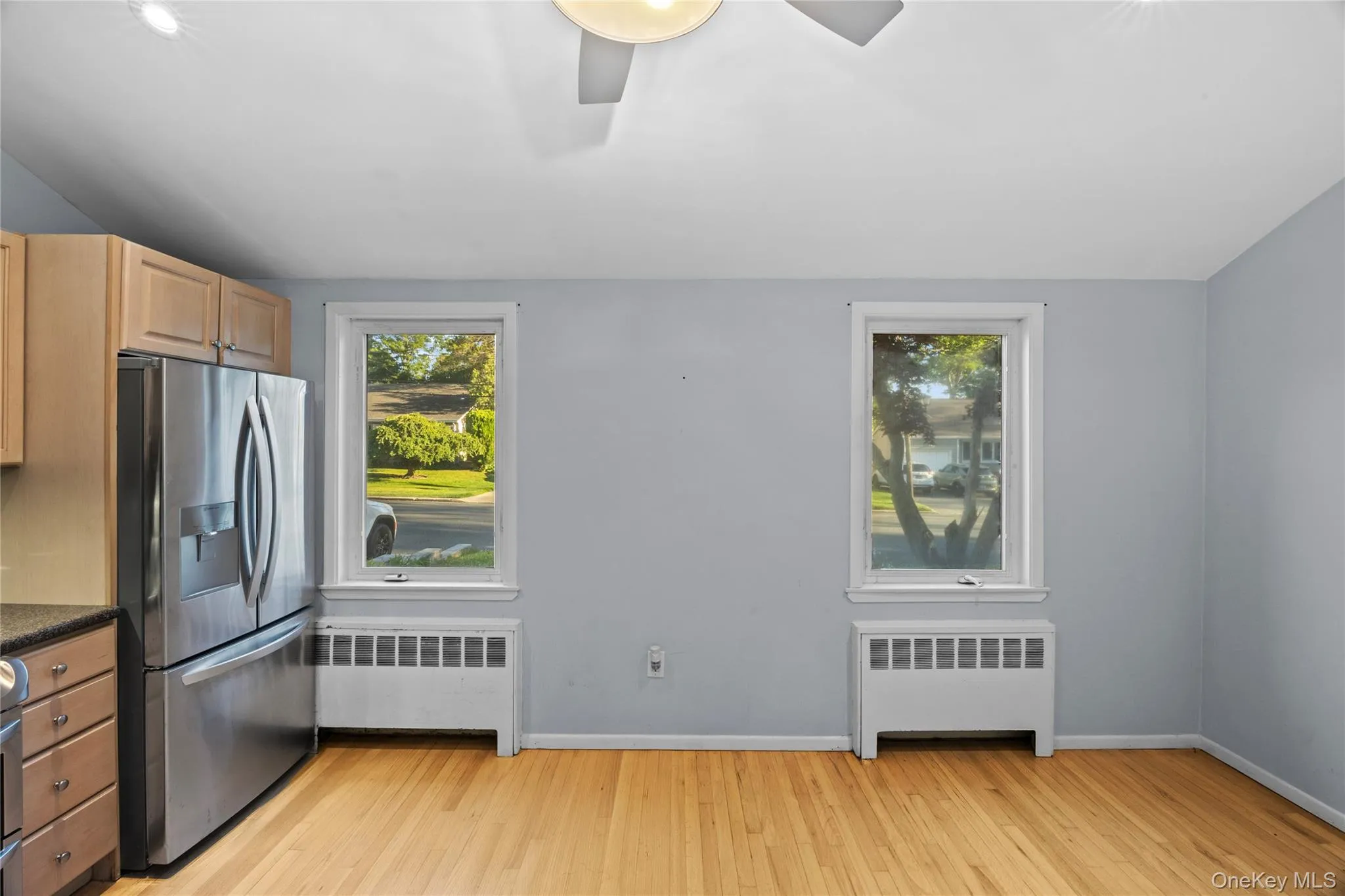 Wood-finish flooring throughout, complemented by a light gray wall finish Wood-finish flooring throughout, complemented by a light gray wall finish