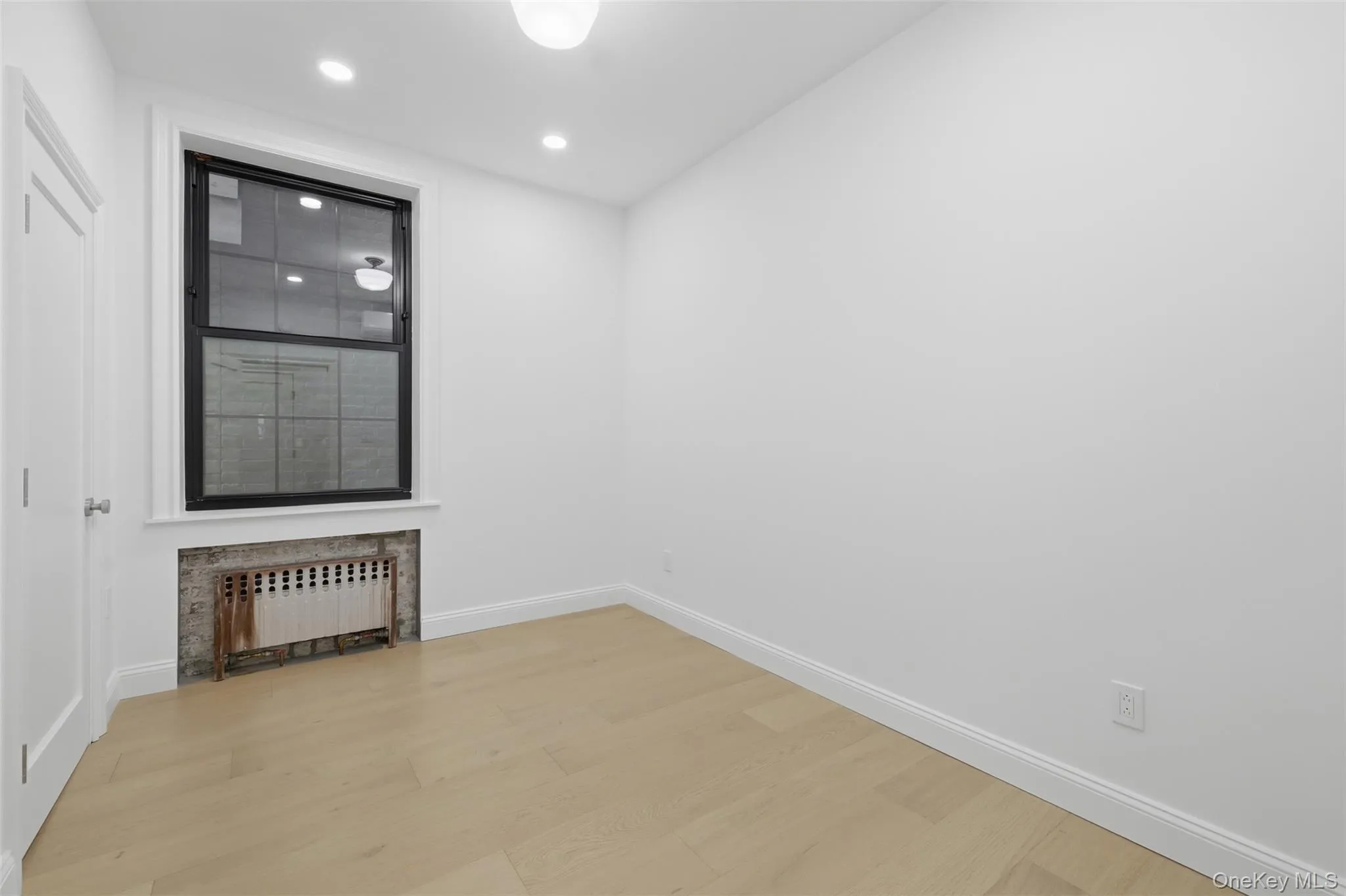 Bedroom 2 with Private Mini-split and original cast iron radiator with heat included + closet Bedroom 2 with Private Mini-split and original cast iron radiator with heat included + closet